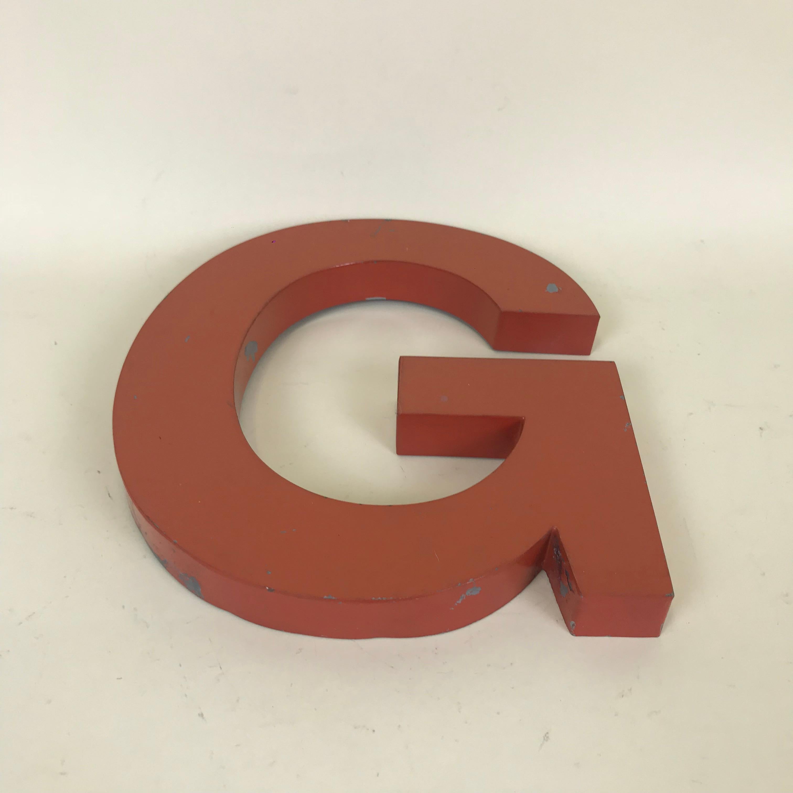Metal vintage orange capital letter G sign made in France in the 1950s.

 