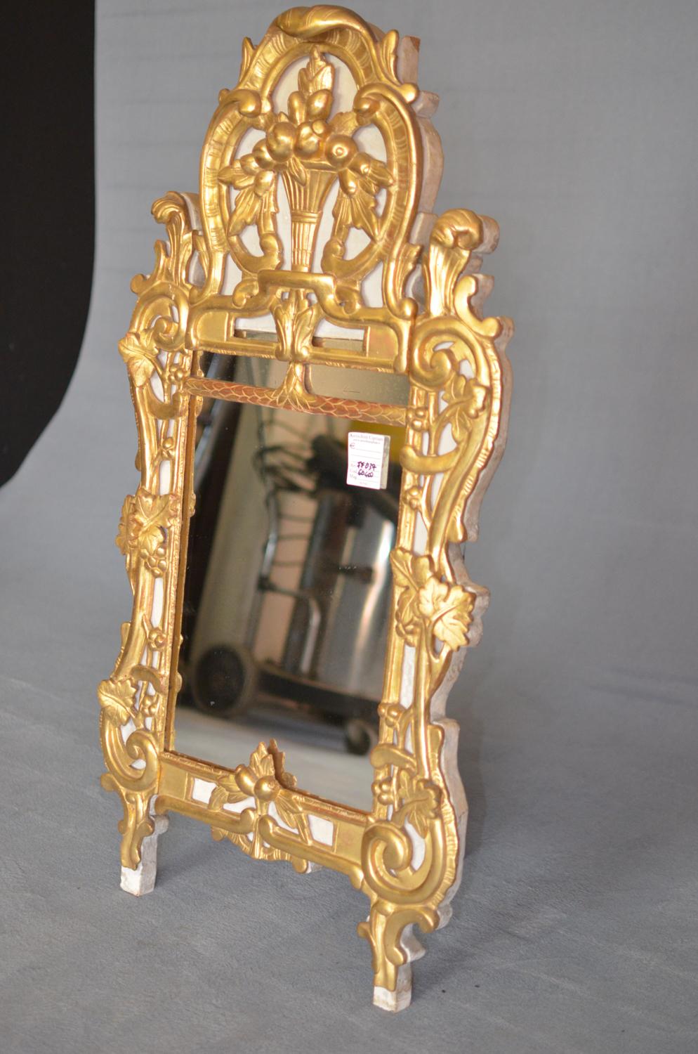 Rectangular Louis XV gold mirror in wood and plaster of French origin dated 1780. The mirror has the front plaster and the back in wood.