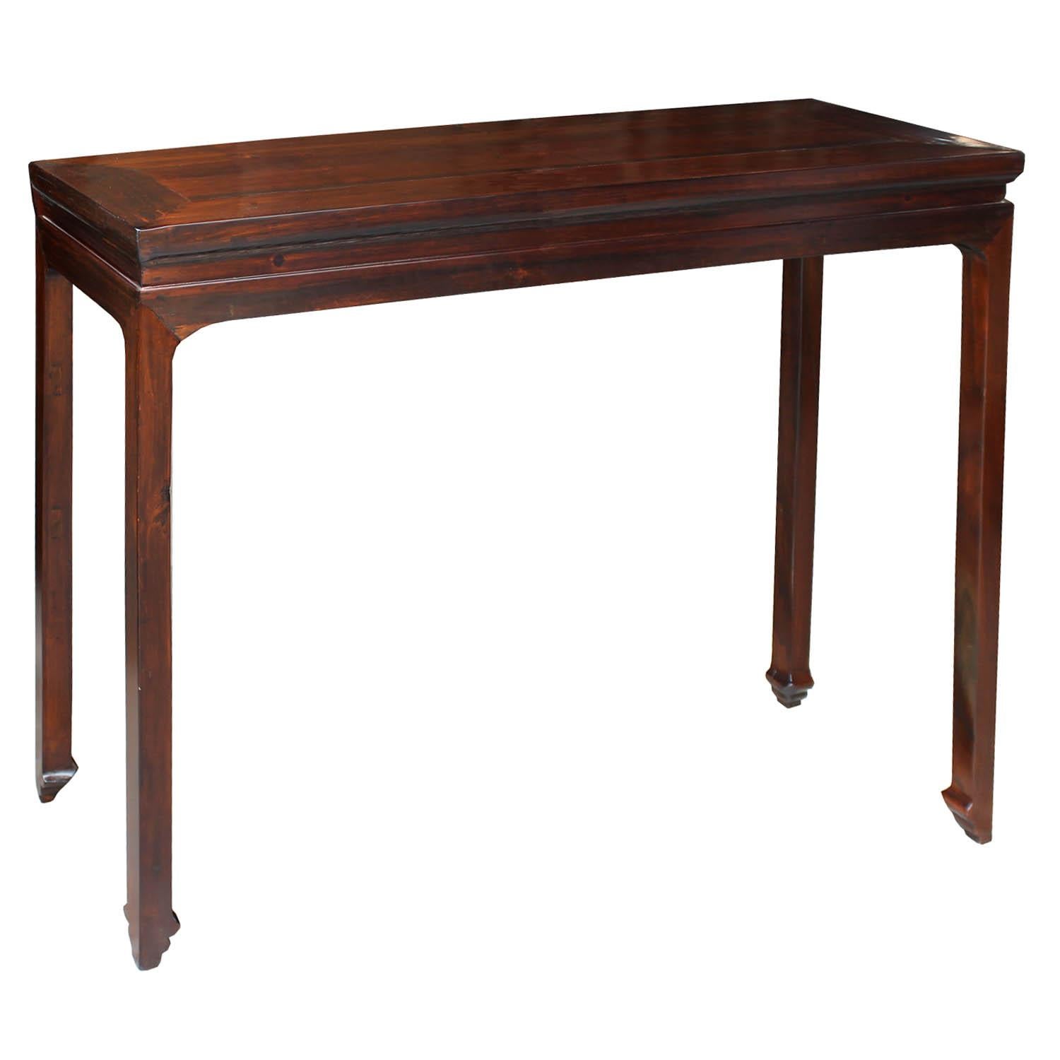 Classic and elegant brown lacquer console table with clean lines can be used in an entry way or behind a sofa. Recessed top with carved feet.