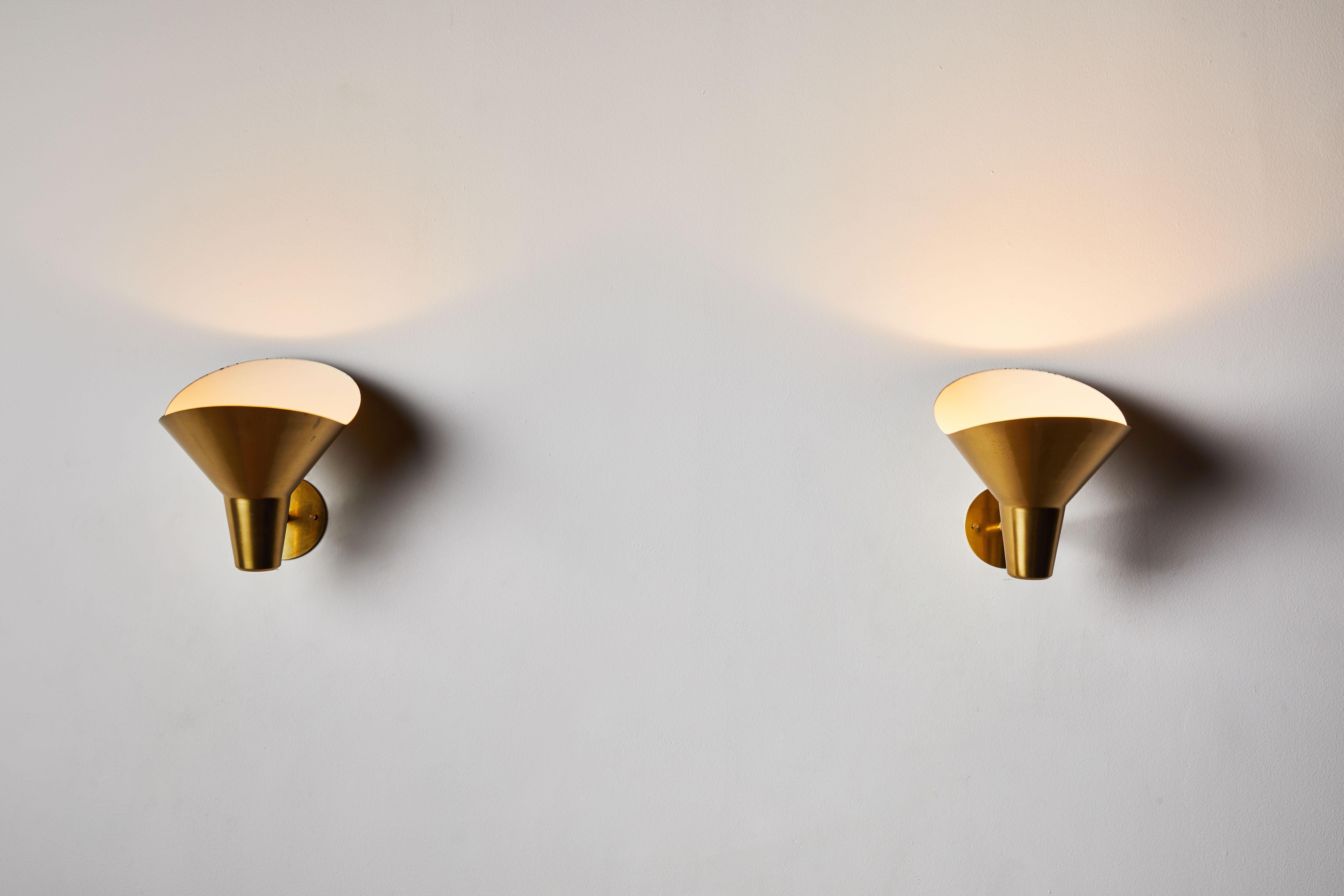 Pair of brass sconces by Hans Bergström for Ateljé Lyktan. Designed in Sweden, circa 1940s. Wired for US junction boxes. Each sconce takes one E27 60w maximum bulb.