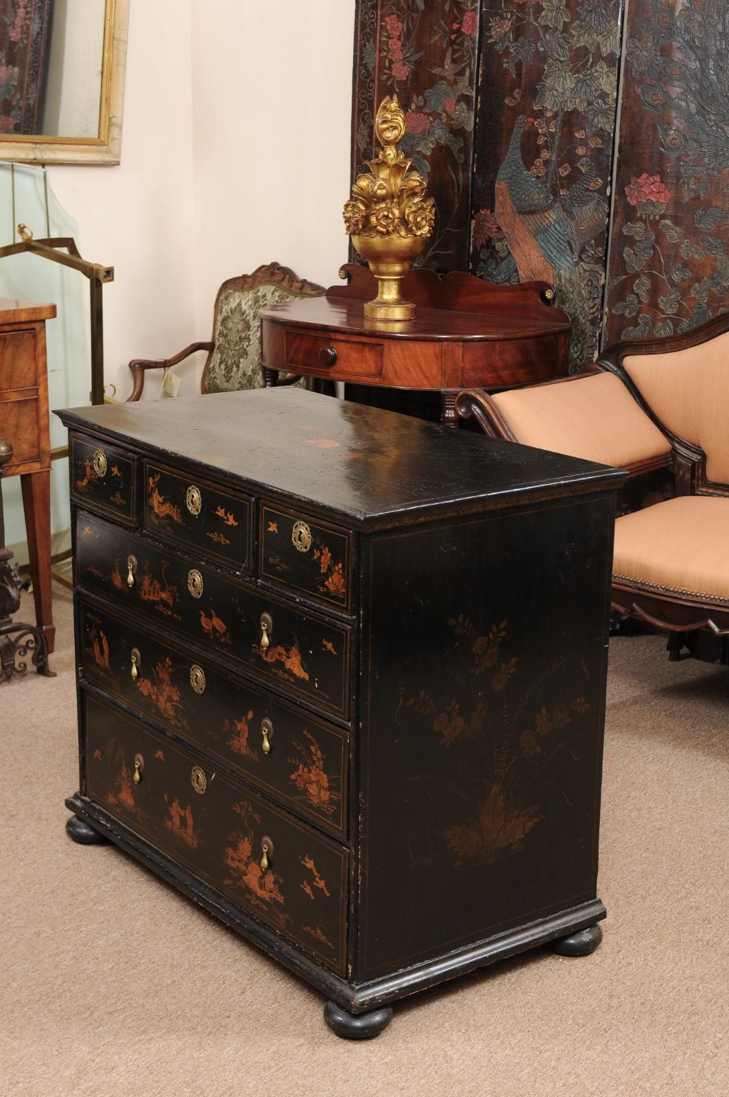The 18th century black painted chest with chinoiserie design, six drawers with brass pulls and bun feet.

 