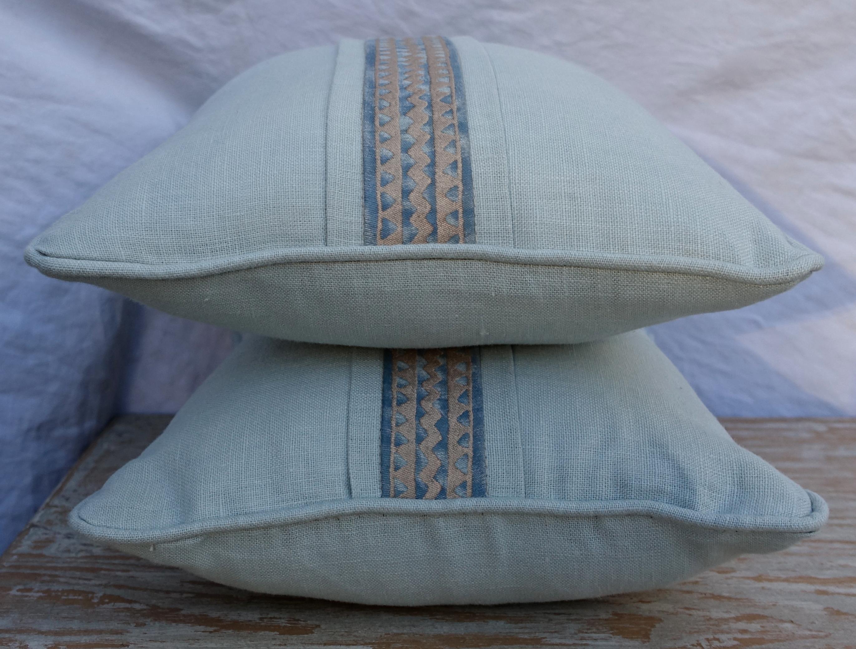 Pair of custom pillows made with vintage blue and silvery gold Fortuny border combined with faded blue linen. Self-cord detail. Down inserts, sewn closed.