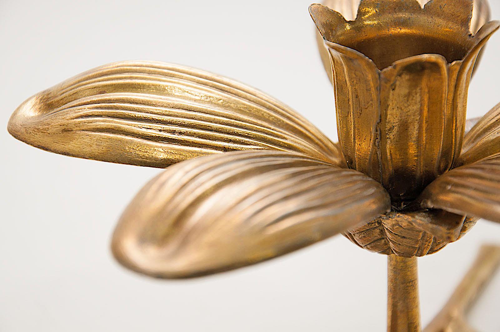 A brass candle holder from Scandinavia, that represent a flower. The petals stand out, and you can move them at your conveyance. The brass is solid brass, so the item is quite heavy compared with his size.
