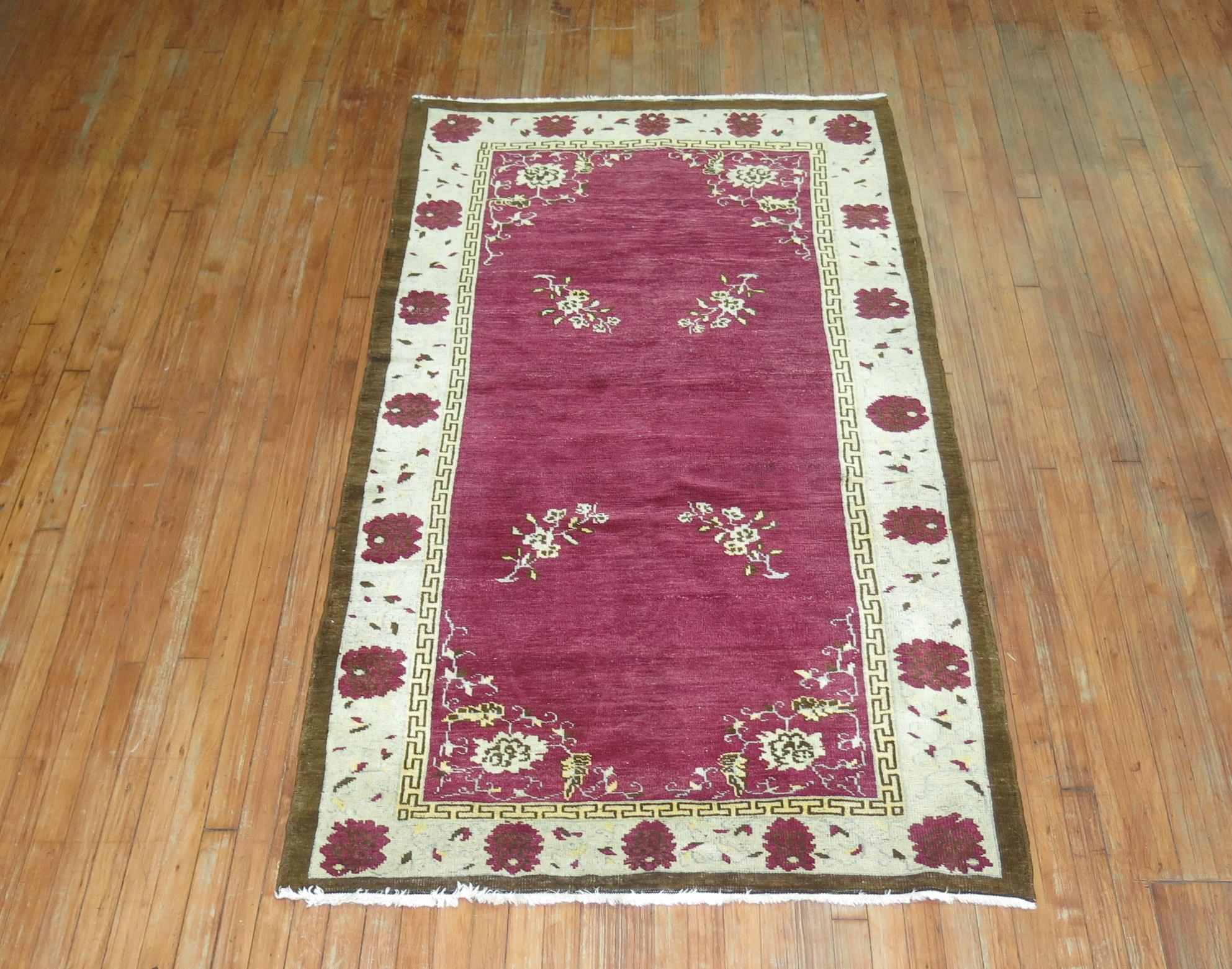 A mid-20th century one of a kind Turkish Anatolian rug with a rare eggplant color background.