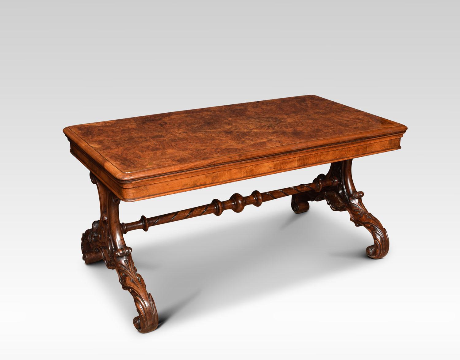 19th century coffee table, the large rectangular walnut top with moulded edge. Raised up on carved platform ends united by stretcher. Terminating in splayed scroll legs. (Adapted).
Dimensions:
Height 20.5 inches
Width 42 inches
Depth 22 inches.