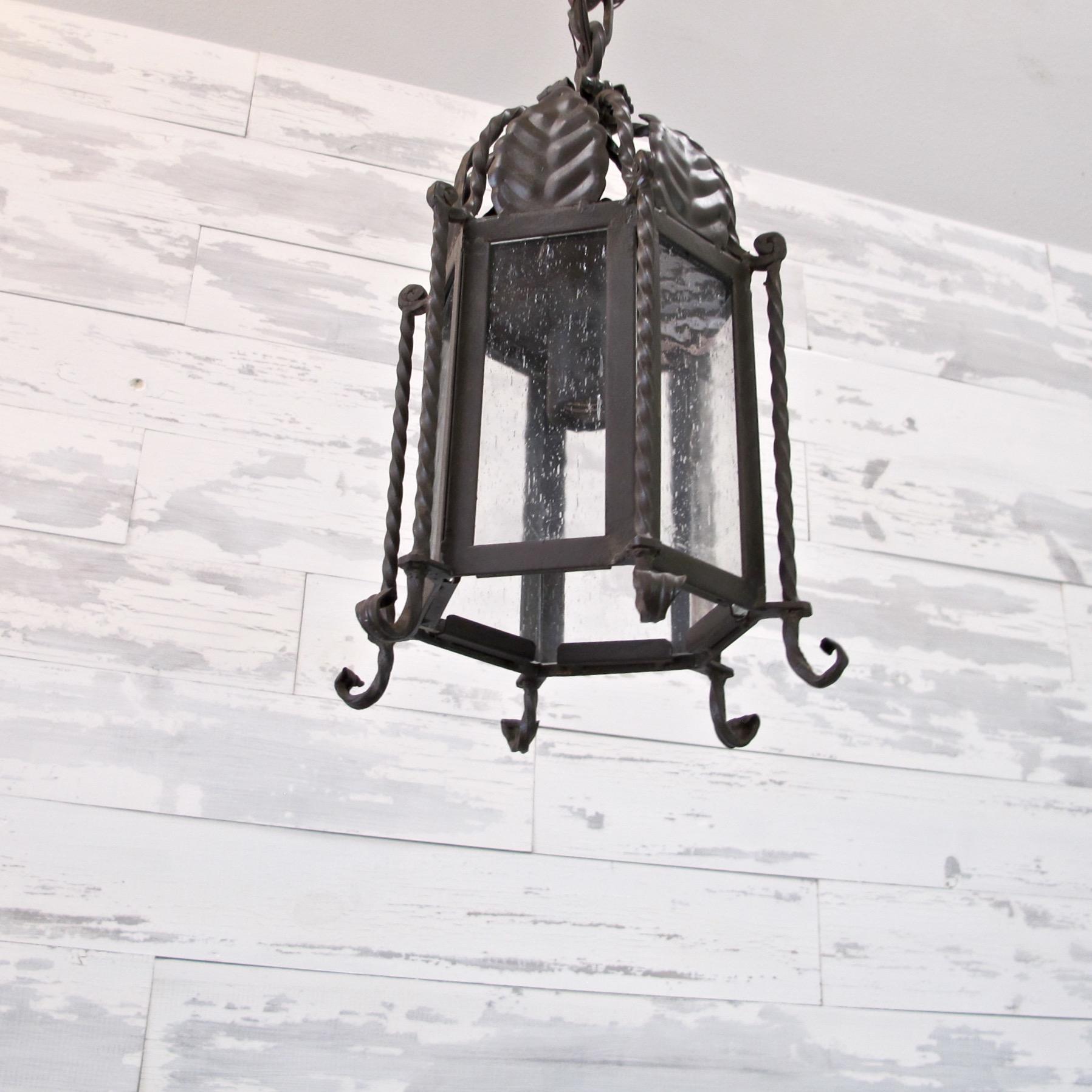 Contemporary Pair of Small Forged Iron Lanterns with Seeded Glass For Sale