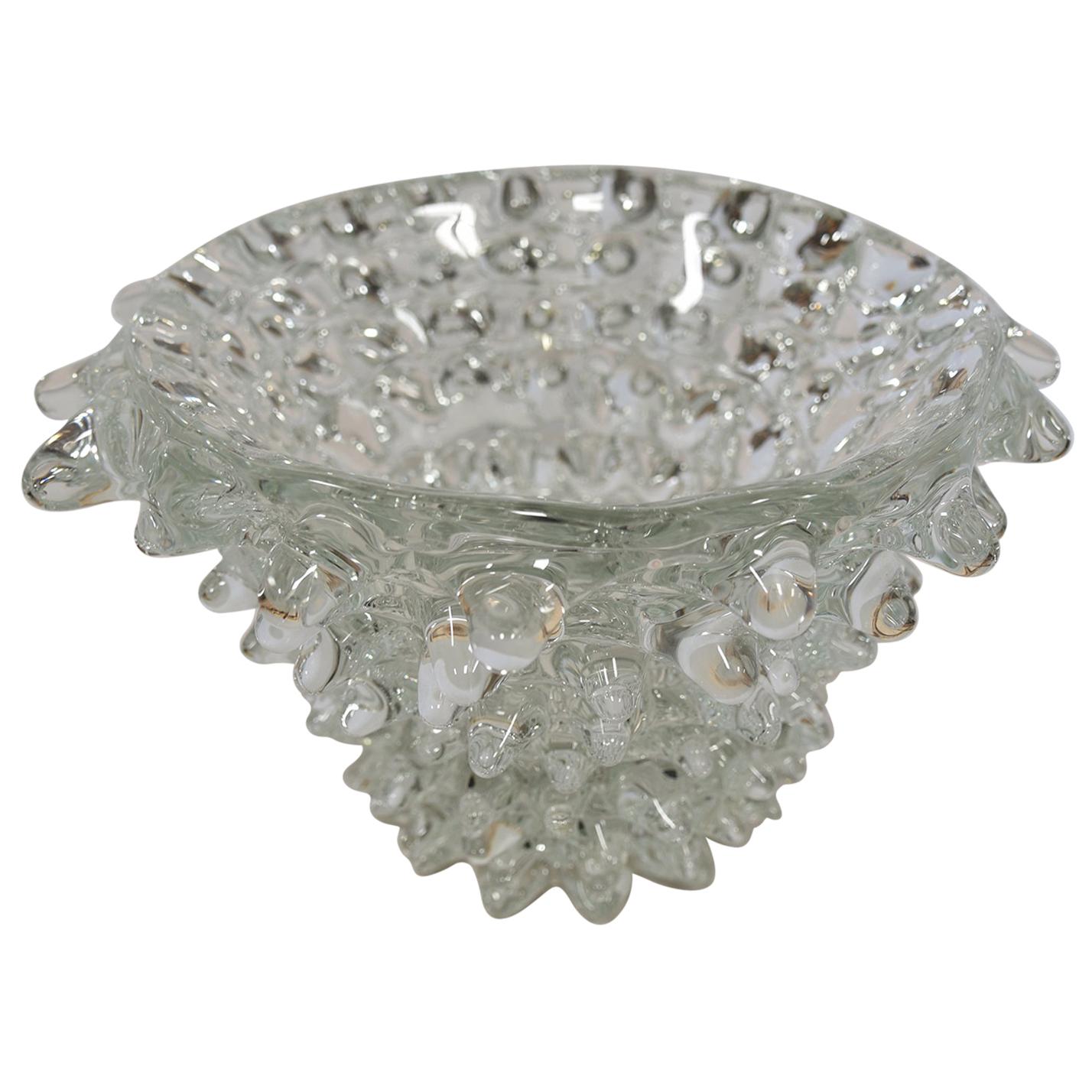 A unique decorative piece for your interior decor; a large clear sculpted Murano glass bowl DESIGNED BY BAROVIER & TOSO with interesting natural ROSTRATO pattern design. Reflecting light and luminosity within your space. Circa 1960. MWM DESIGN
