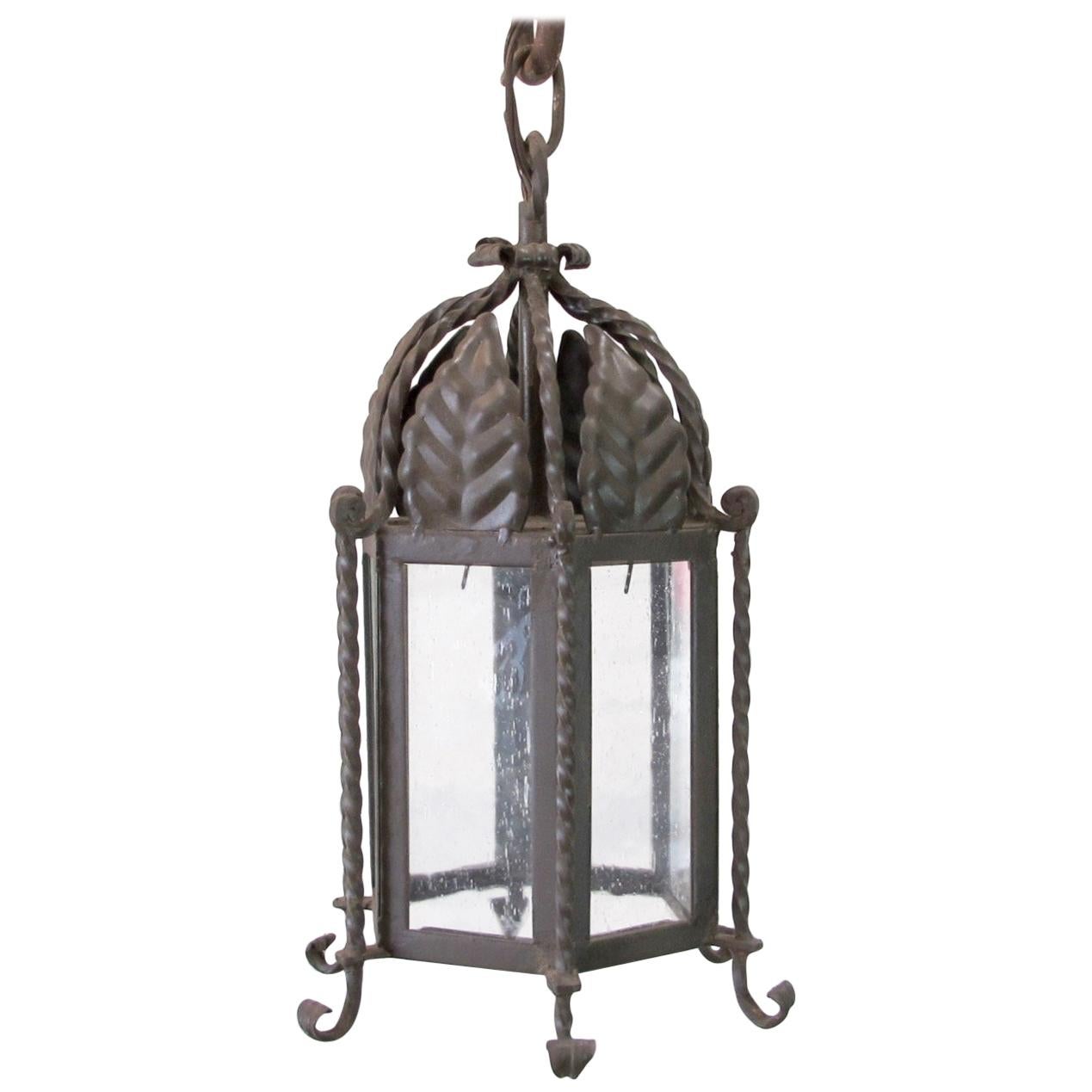 Pair of Small Forged Iron Lanterns with Seeded Glass For Sale