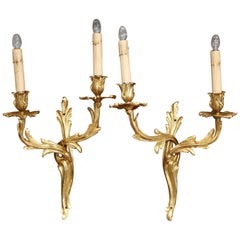 Pair of Early 20th Century French Louis XV Two-Light Gilt Bronze Wall Sconces