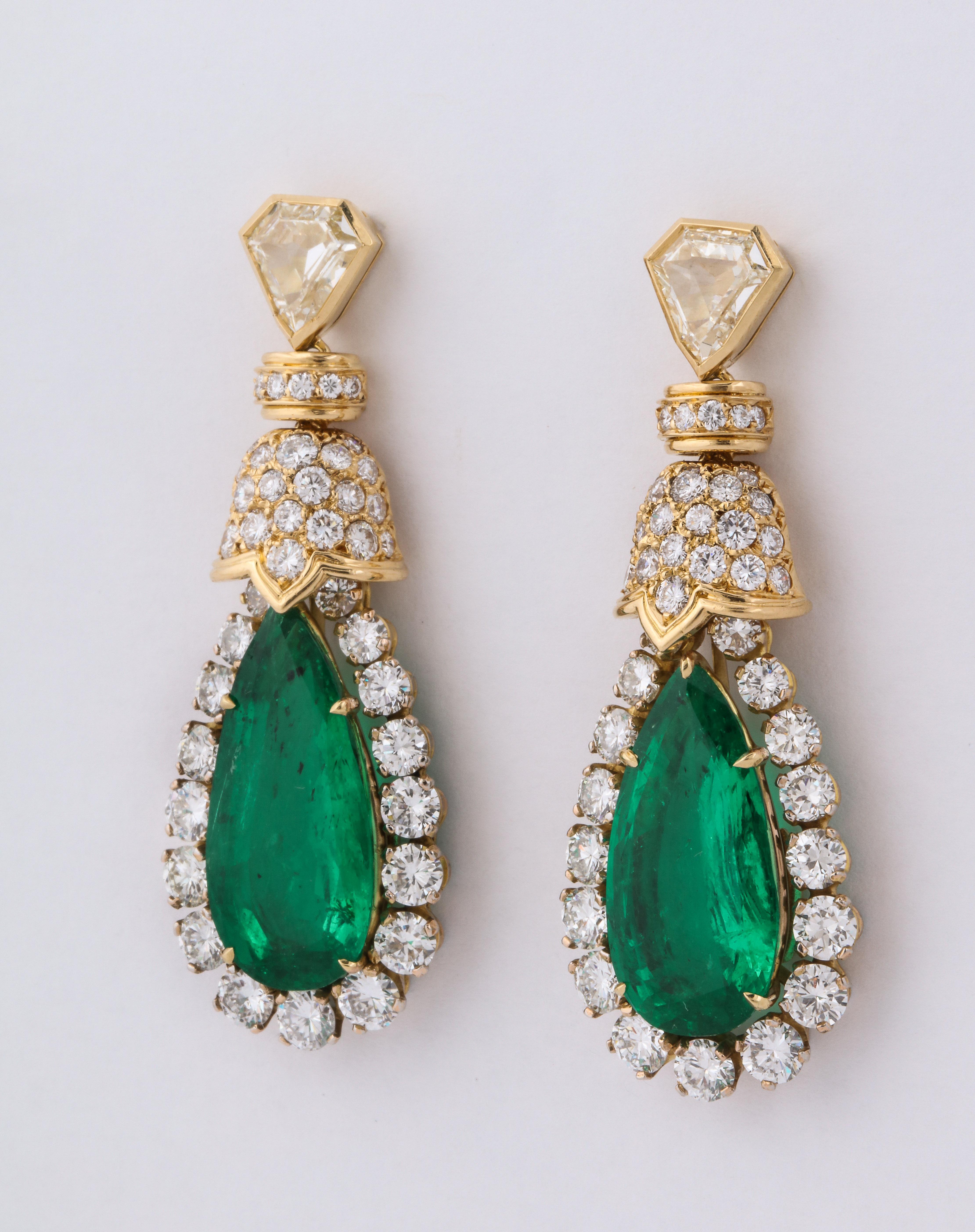 David Webb pear shaped emerald and diamond earrings. 2 pear cut emeralds @ 16 ct tw, 2 kite shaped diamond @ 2 carats J/VVS1, 88 full cut fine white diamonds @ 8.6 cts. 18K gold, 4 gm 22.7 gm. 1 7/8 inches long, 6/8 inches wide, 3/8 inches deep.