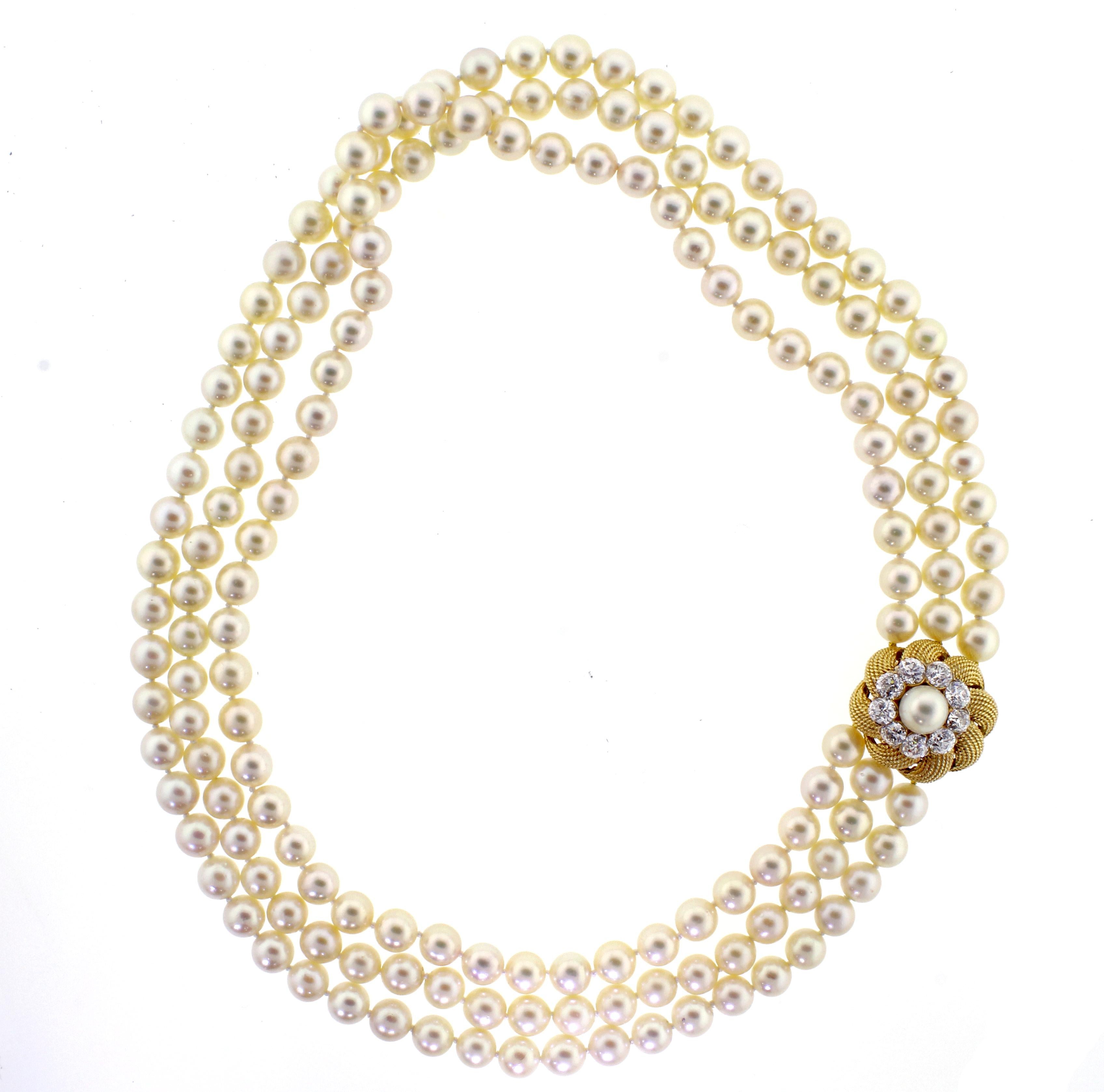 From David Webb, a pearl and diamond necklace comprised of three strands of 8-8.5mm cultured pearls and a stunning diamond clasp.  The clasp boast 9 old European cut diamonds weighing approximately 4 carats. The diamonds are F -G color and VS