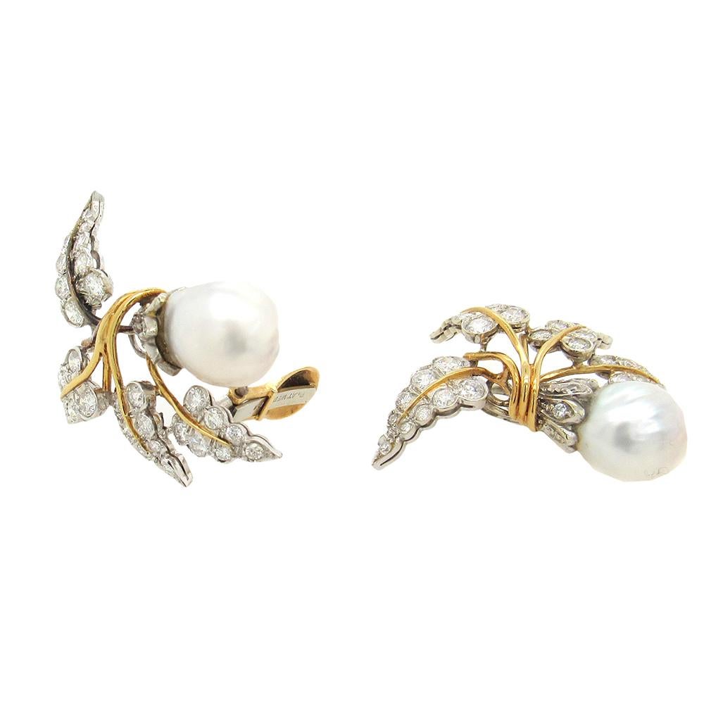 Platinum, diamond and 18K yellow gold vintage David Webb clip on  earrings, circa 1950's, with curving gold and platinum leaves set with diamonds and baroque pearls, 12mm x 13mm.  The earrings measure 1-3/8
