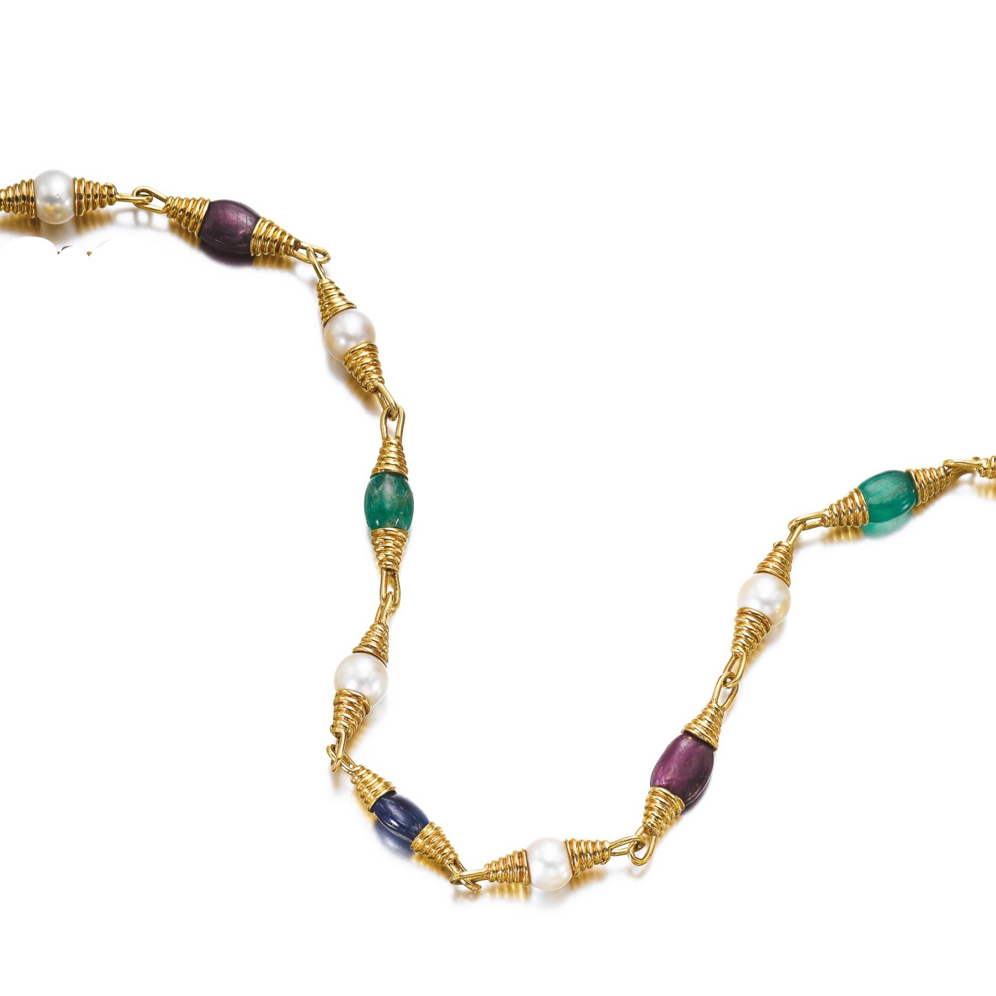 David Webb necklace of yellow gold with cultured pearls and emerald, ruby and sapphire beads. Length approximately 430mm, signed Webb and numbered. Made in in the US, circa 1975.
