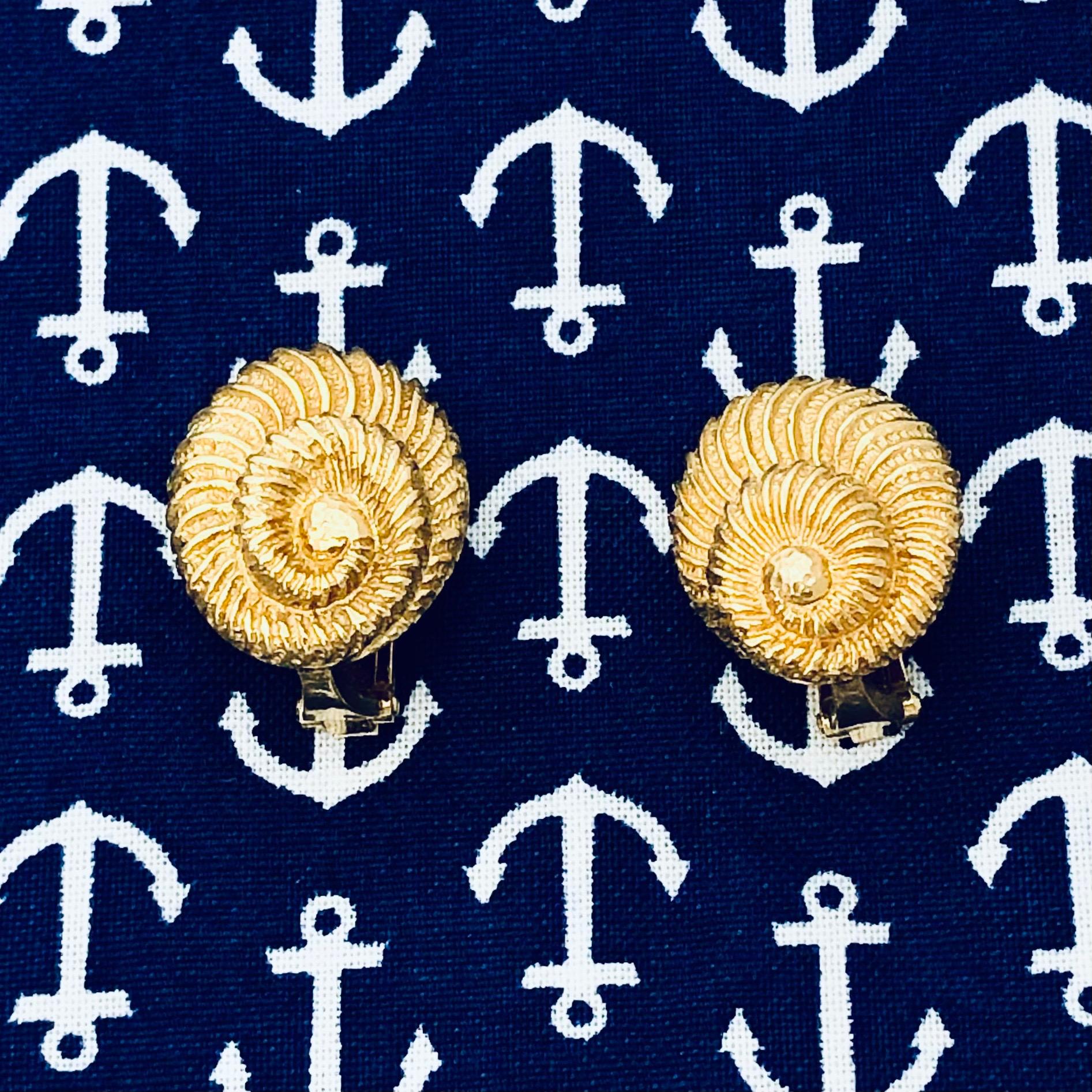 This very life like pair of Webb seashell earrings are crafted with tremendous detail from 18k yellow gold and measure 13/16 inches by 5/8 inches and rise, at their apex, to 3/8 inches above the ear giving making them three dimensional. The use of a
