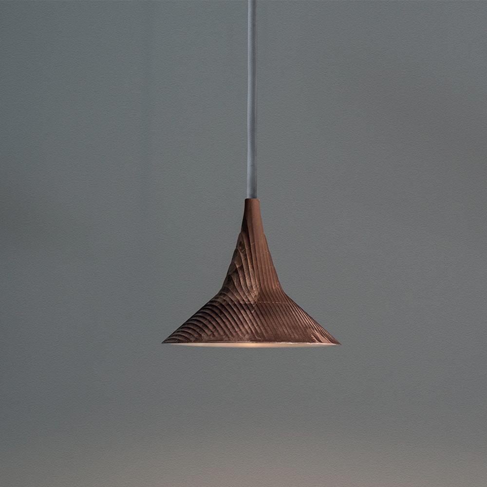 Designed for the museum in Colmar, France, Unterlinden is a suspension lamp which combines the aesthetic charm of a vintage object with contemporary technology and engineering. 

The heat-dissipating body comes in either die-cast aluminum or bronze,