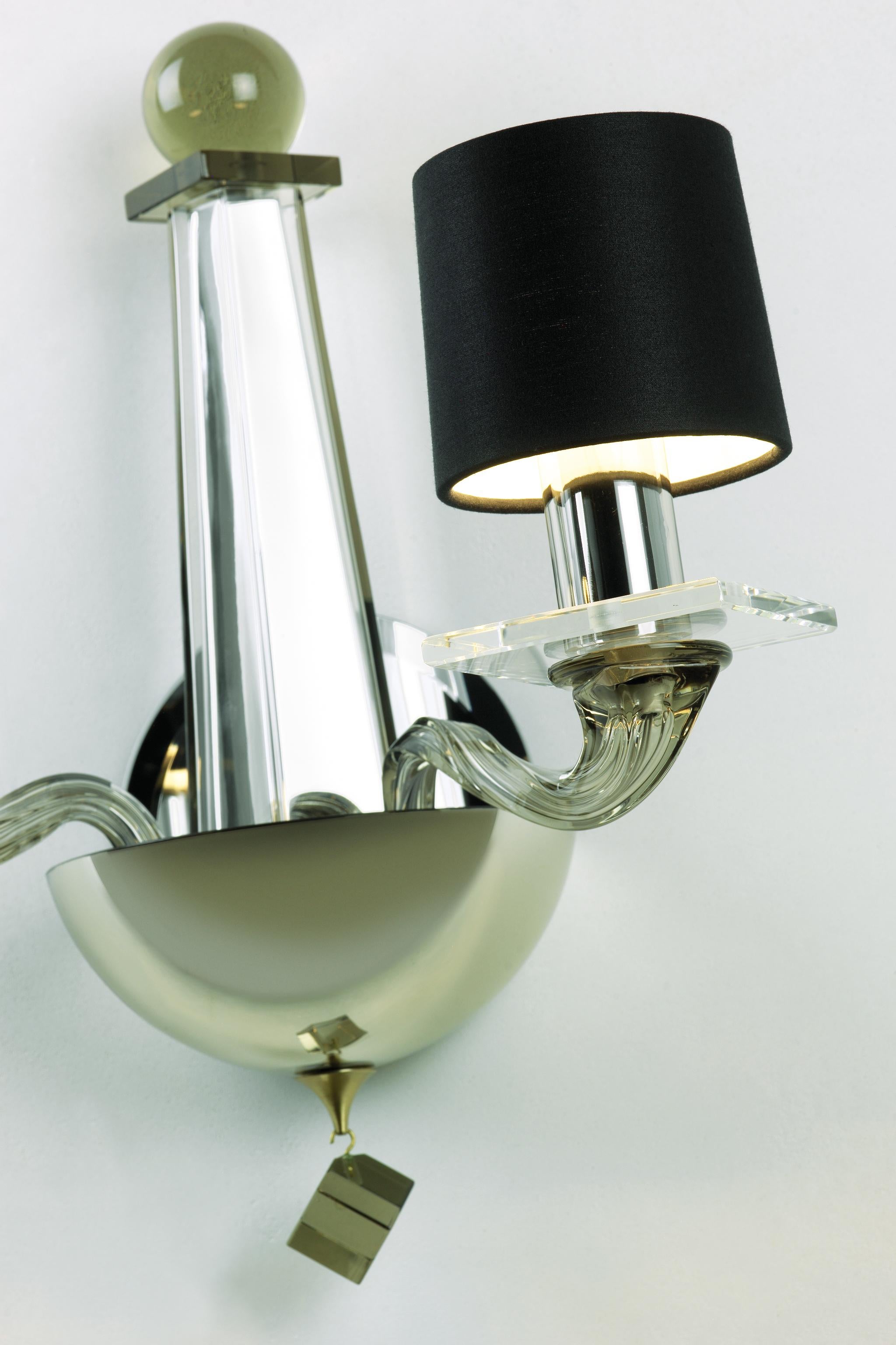 A stunning handblown Venetian glass sconce with two arms and infinite charm. The two-arm wall sconce in handblown Murano glass. Grey glass, hand-silvered glass, and brass hardware.

- Backplate Dimensions: 5.5