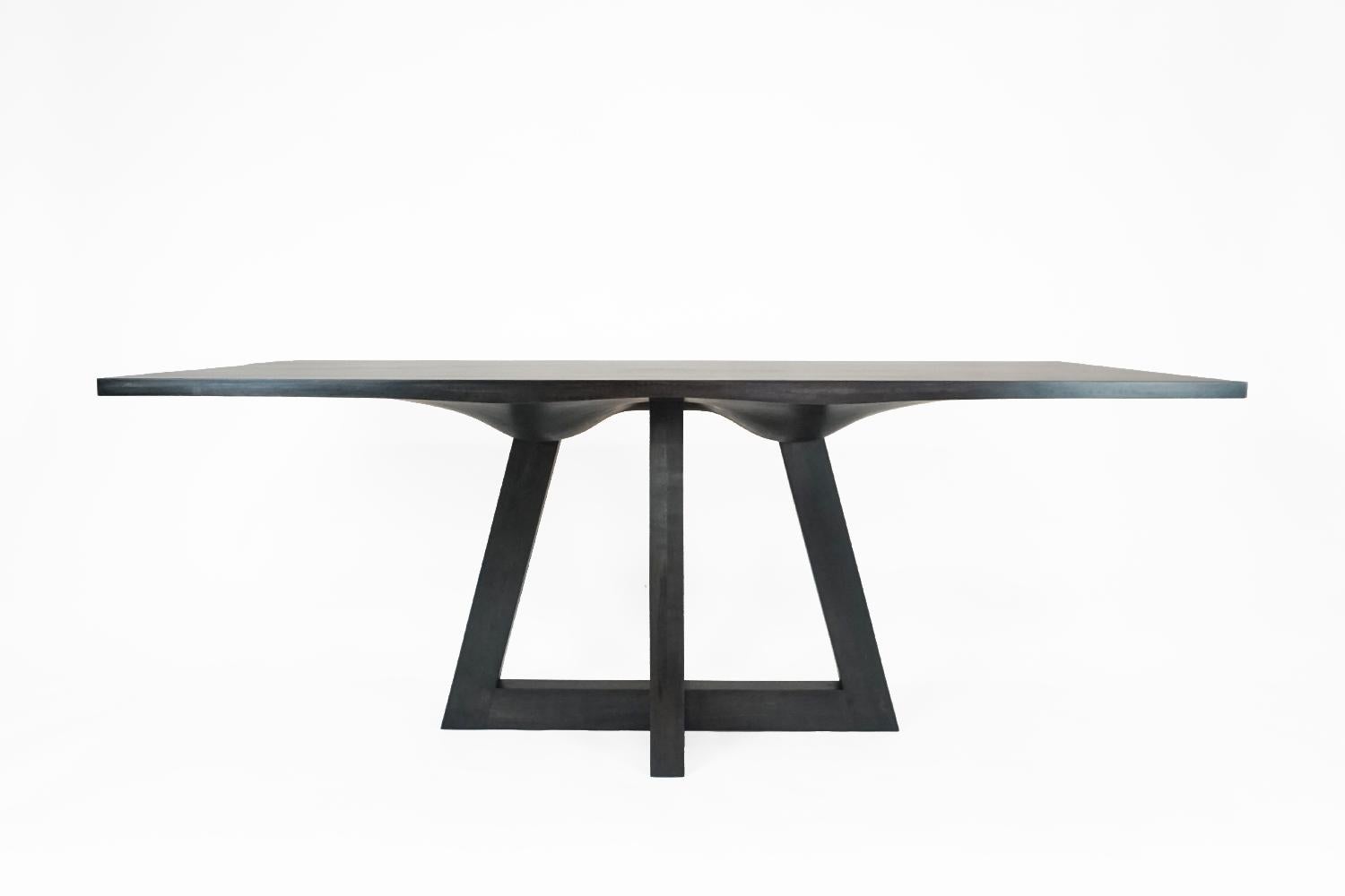 Ebonized dining table by Vincent Pocsik

Vincent’s work balances old and new fabrication techniques to breathe new life into materials while holding onto the richness of the past. This process is influenced by the desire to push the traditional