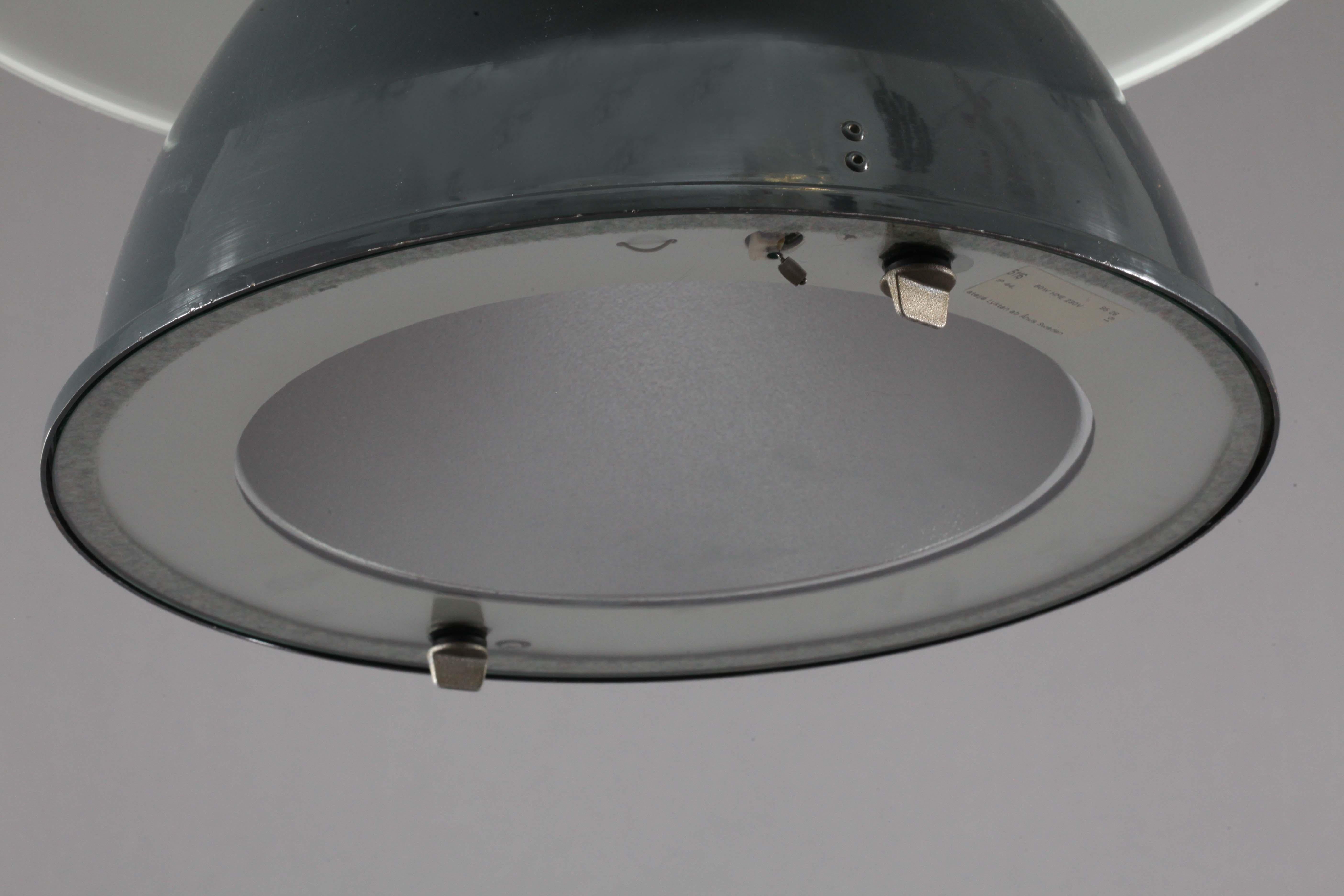 Industrial ceiling lamp,
Germany, 1940.
Dark green enameled metal, white enameled reflector
E 27 bulbsocket maximal 100 watt.
 