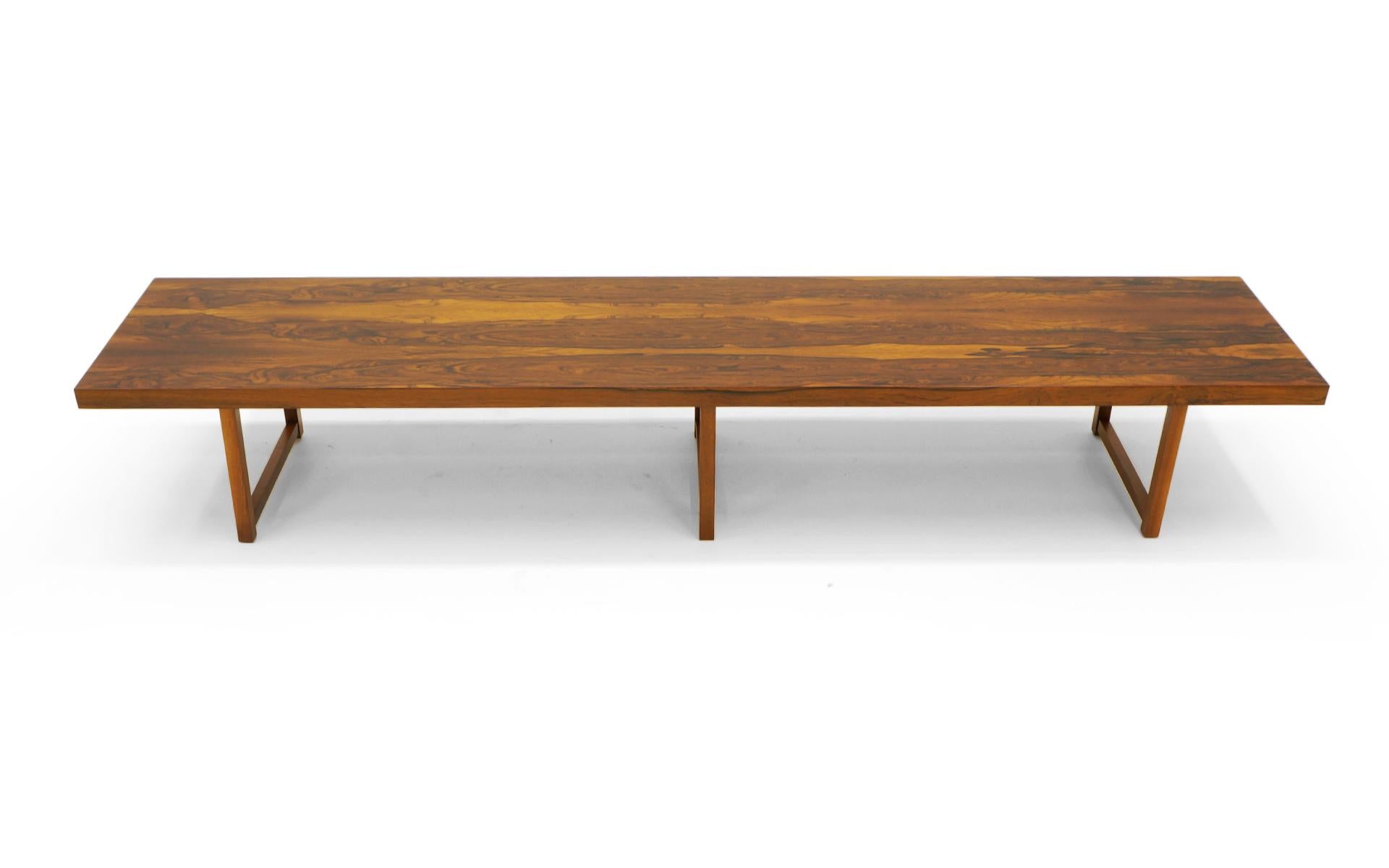 Stunning Brazilian Rosewood, 8 feet long (96 inches), bench (or coffee table) by Milo Baughman for Thayer Coggin. The figuring in the rosewood is exceptional. Free of any scratches, dents, or chips. Condition is excellent. Signed with the Milo