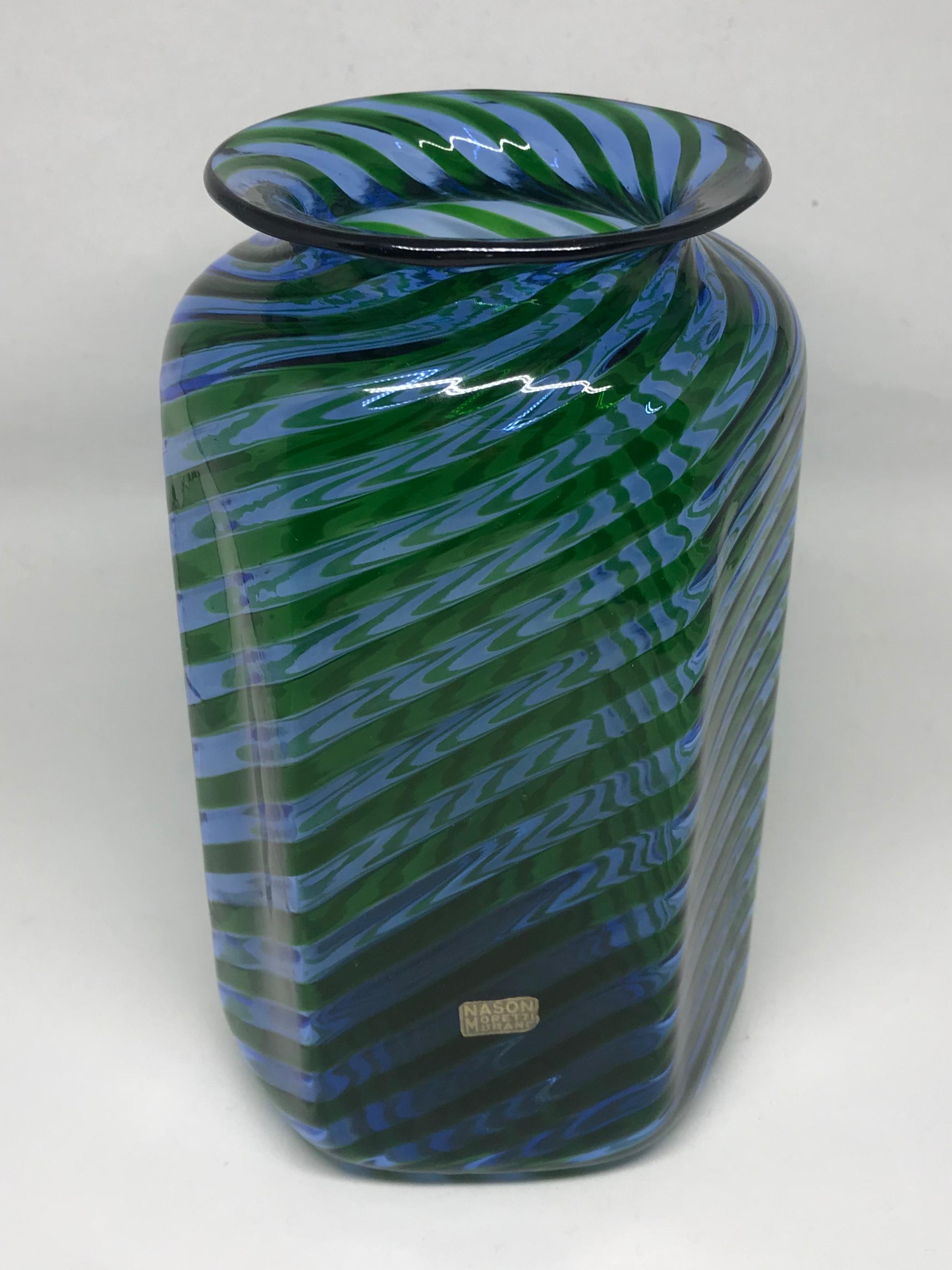 Blue green Nason Moretti Murano vase. Pale blue and green striped softly hexagonal vase with swirled neck and original Nason Moretti Murano label. Italy, circa 1940.
Dimensions: 4.5