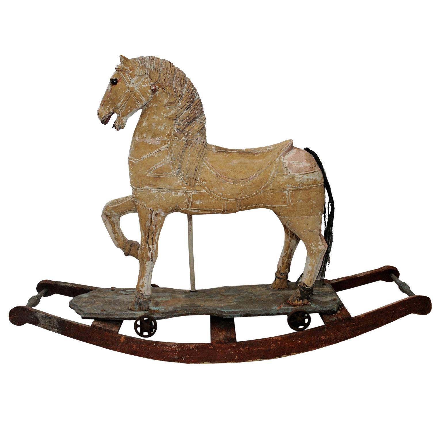 This is a really beautiful French mid 19th century decorative Rocking or Trolley Horse of great character, in its original worn antique condition. Wheeled horse would have been unbolted from rocking base, circa 1870.

 