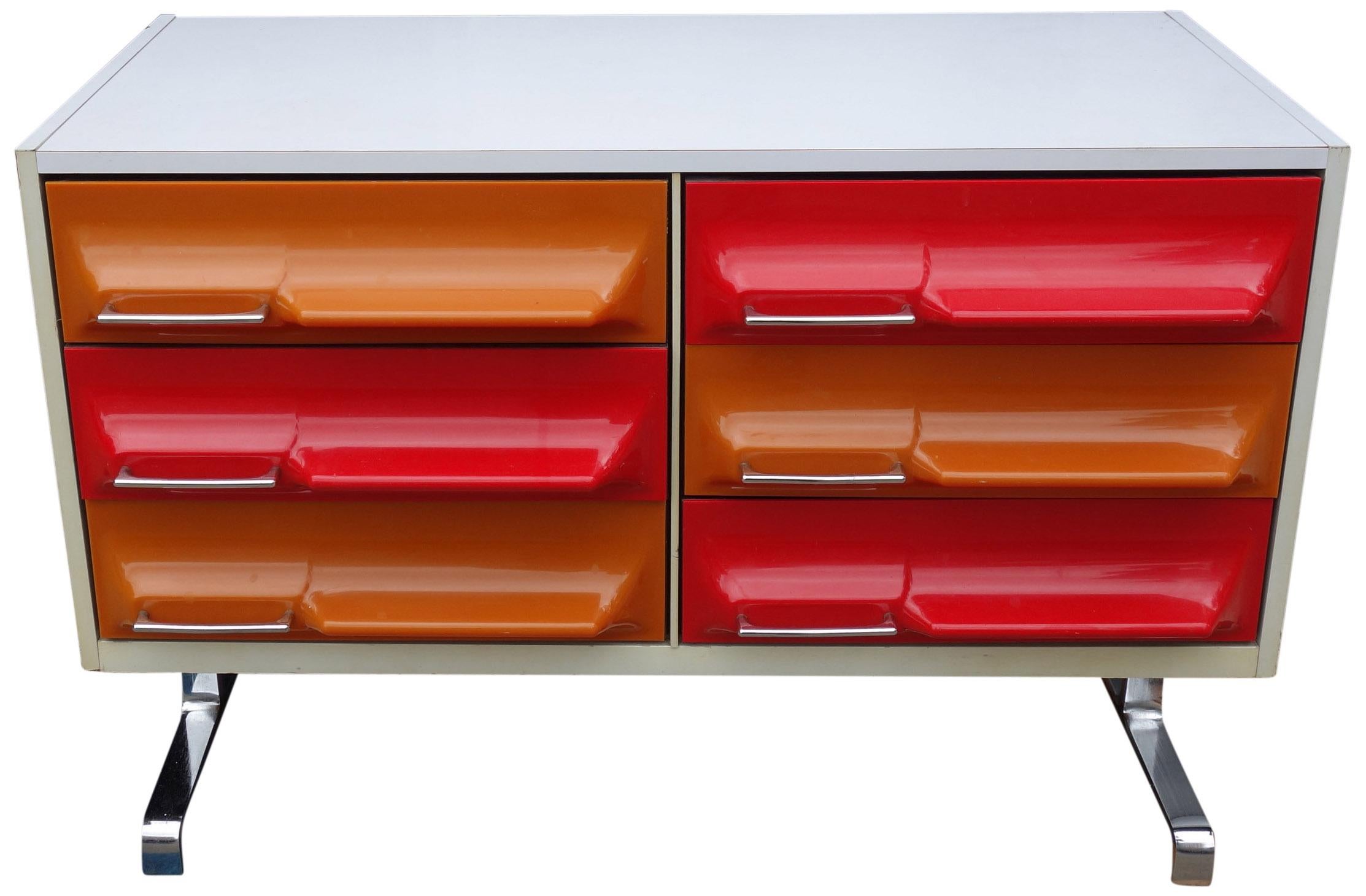 Similar to Rayond Loewy DF200 pieces and produced around the same time. These fantastic space-age dressers are a wonderful way to brighten up your space. Wonderfully crafted featuring ABS plastic fronts on chrome legs. Total depth including fronts
