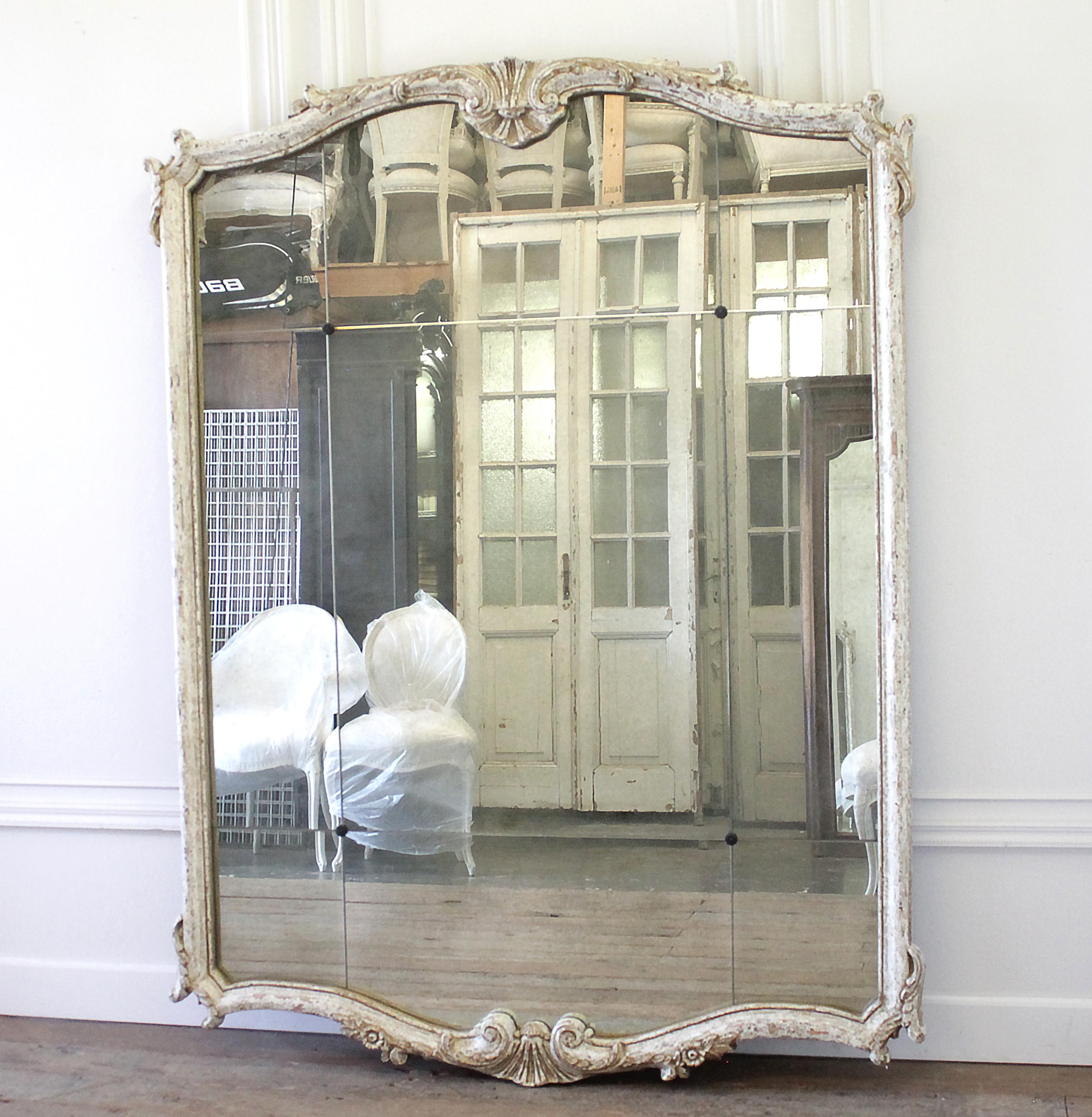 Vintage decorative mirror in wood frame.
Gold and creamy white distressed frame, with antique mirror panels, and rosettes.
Ready to hang.
Measures: 60