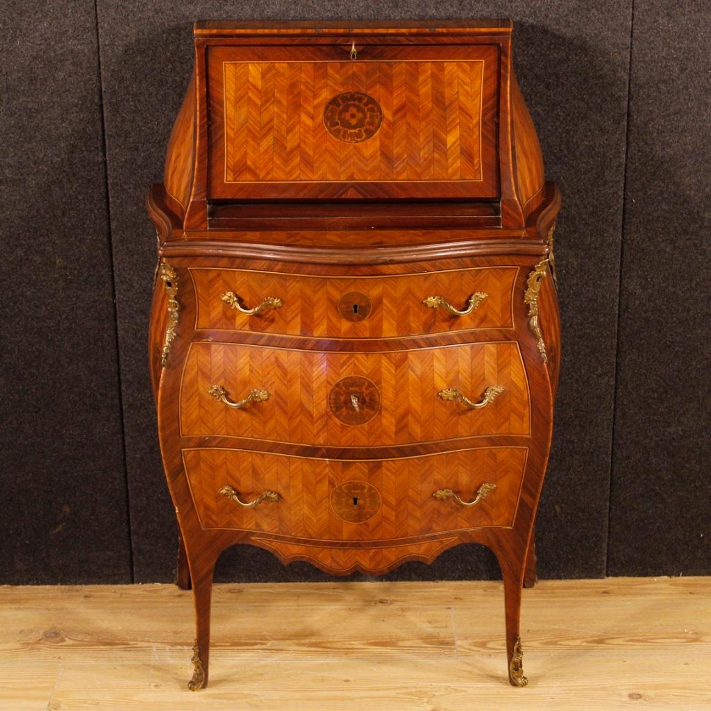 Italian bureau from 20th century. Furniture of nice line and pleasant decor, inlaid with palisander, walnut, rosewood and maple. Bureau equipped with three drawers (complete with a working key) of good capacity, fall-front with a small writing top