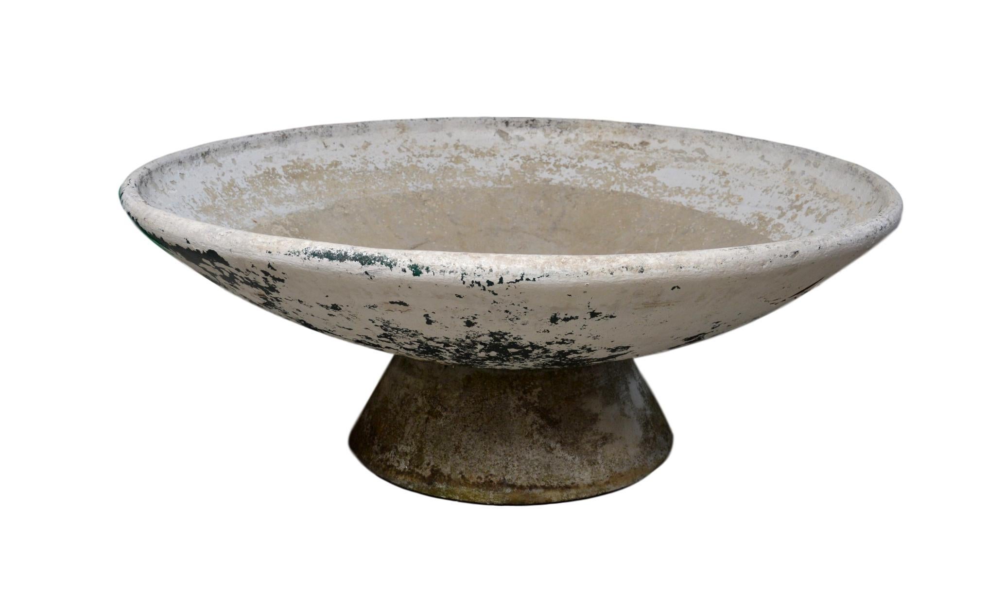 Fantastic cement planter by Swiss designer Willy Guhl for Eternit. Concrete pedestal base with massive concrete bowl that sits on top. Bowl can sit flat or angled in a multitude of directions. Great original patina. Great for indoors or