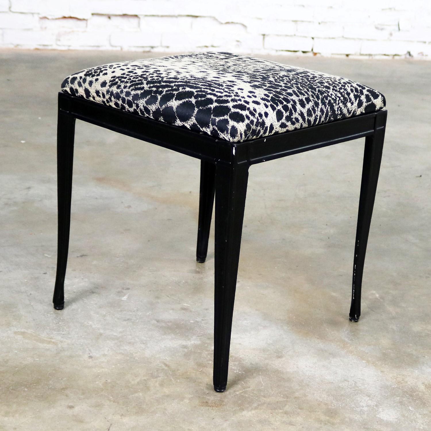 What an awesome Art Deco, well possibly Hollywood Regency, little bench, ottoman, or footstool by Crucible Products Corp. and attributed to David Weinstock. Black painted cast aluminum frame and upholstered in a fabulous black and beige animal print