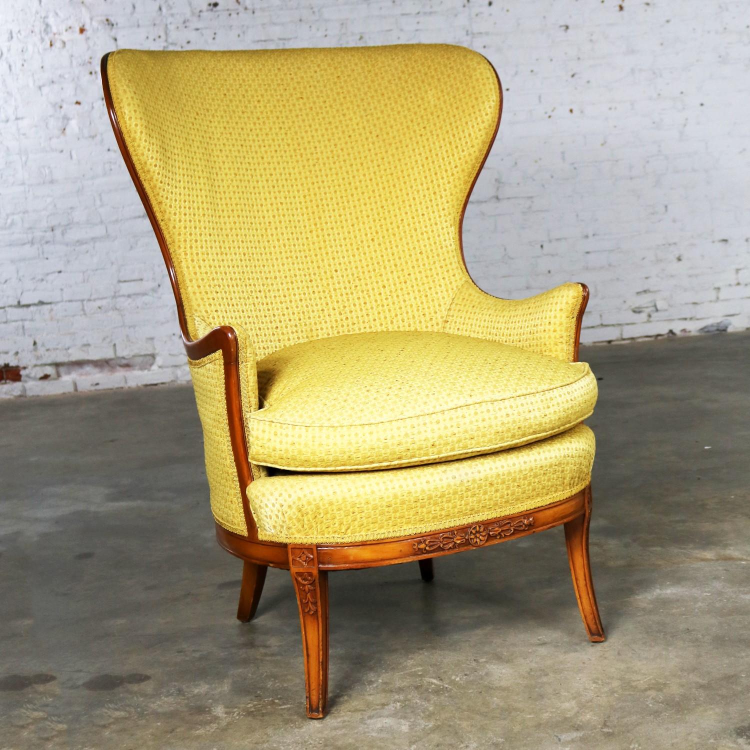 Handsome Art Deco style high wingback lounge chair with loads of detail. It retains its original tag from John M. Smyth Company in Chicago. And, its original beautiful upholstery which is still beautiful today. It is in wonderful vintage condition
