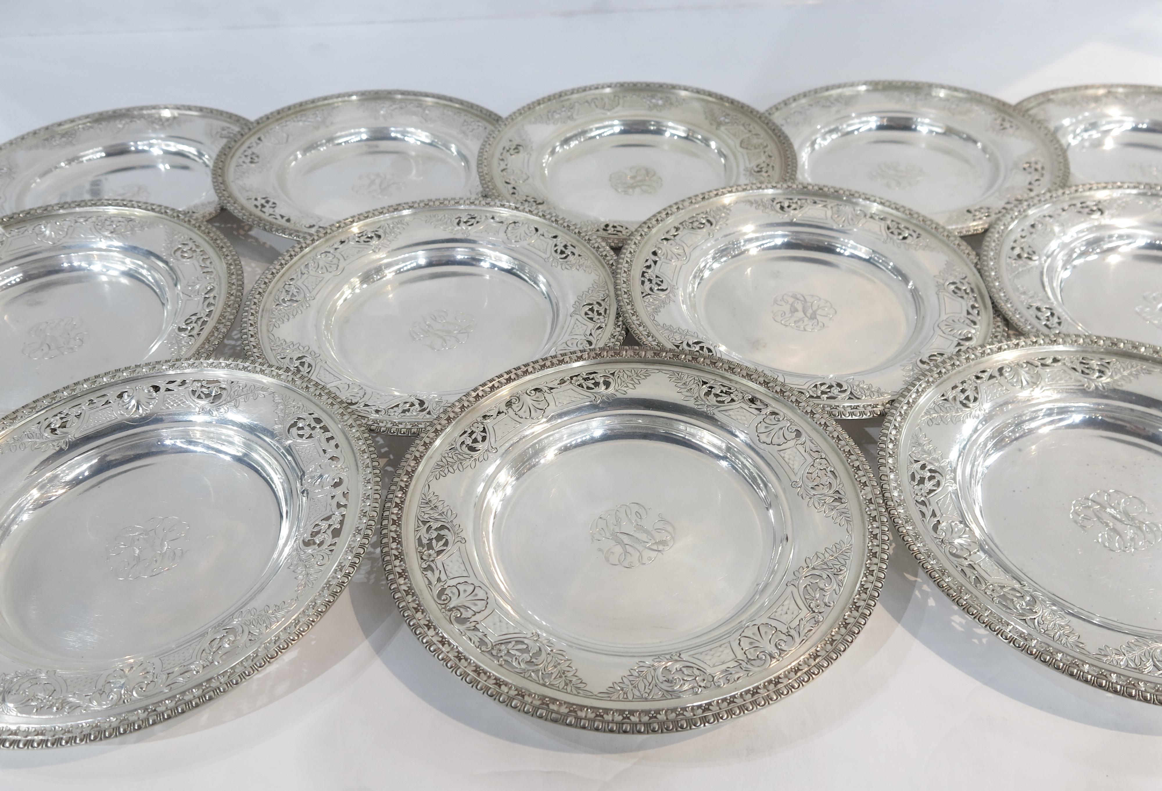 12 Antique sterling silver dessert plates made by Black, Starr & Frost, circa 1900. Each with a cast border and hand chased and pierced decoration, centred by a beautiful hand engraved monogram.
Each plate is marked on the underside with the