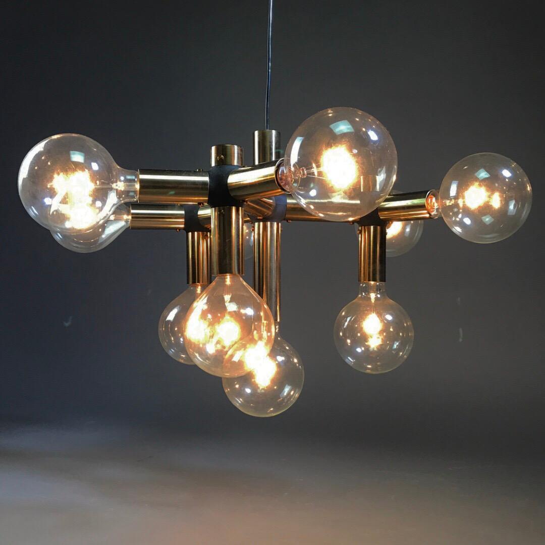 Highly sought after gold edition molecule chandelier by renowned Trix and Robert Haussmann for Swiss lamp International 1960s. 

All original gold edition chandelier with black linkage and golden canopy. 

Excellent condition without any