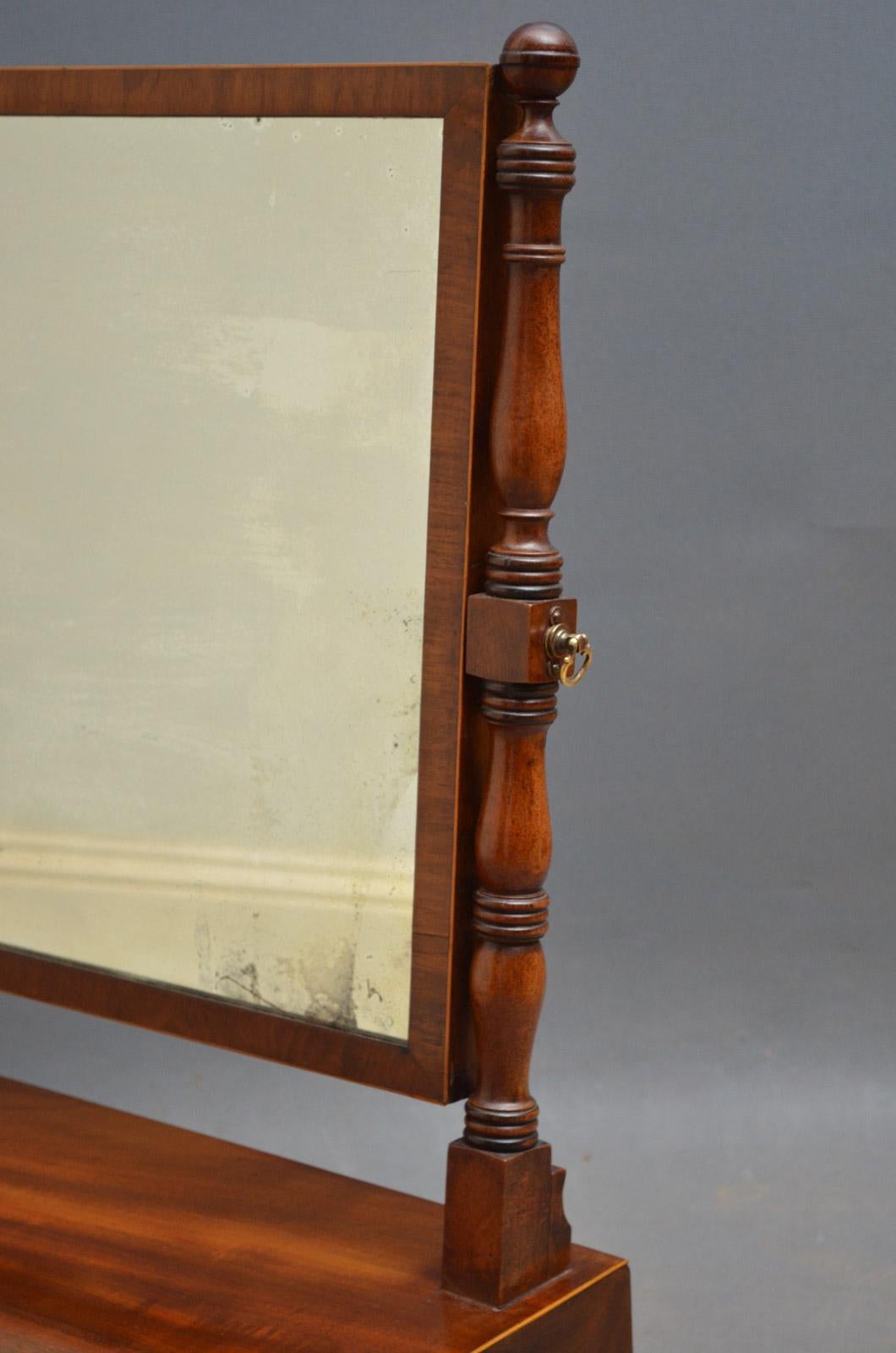 Sn3284 attractive regency, mahogany toilet mirror, having original plate in turned baluster uprights, inverted breakfront plinth base with three Greek key inlaid drawers, all standing on bun feet, circa 1810
Measures: H25
