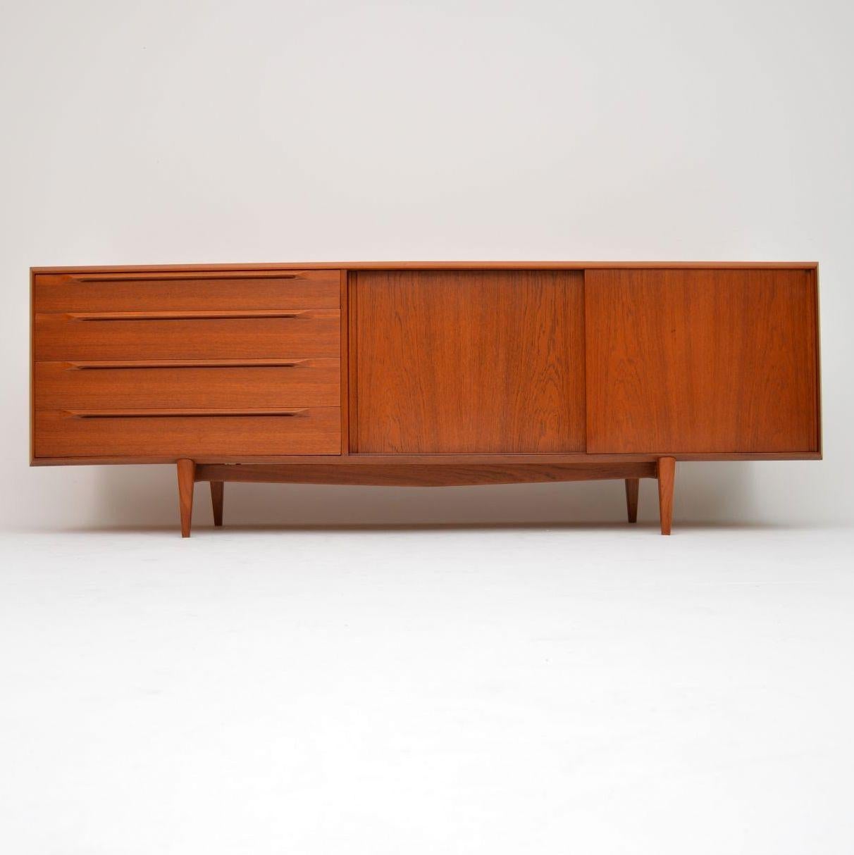A magnificent and rare Danish sideboard in teak, this was made by Bernhard Pedersen in the 1960s. The quality is absolutely amazing, we have had this fully stripped and re-polished to a very high standard, so the condition is superb throughout. This