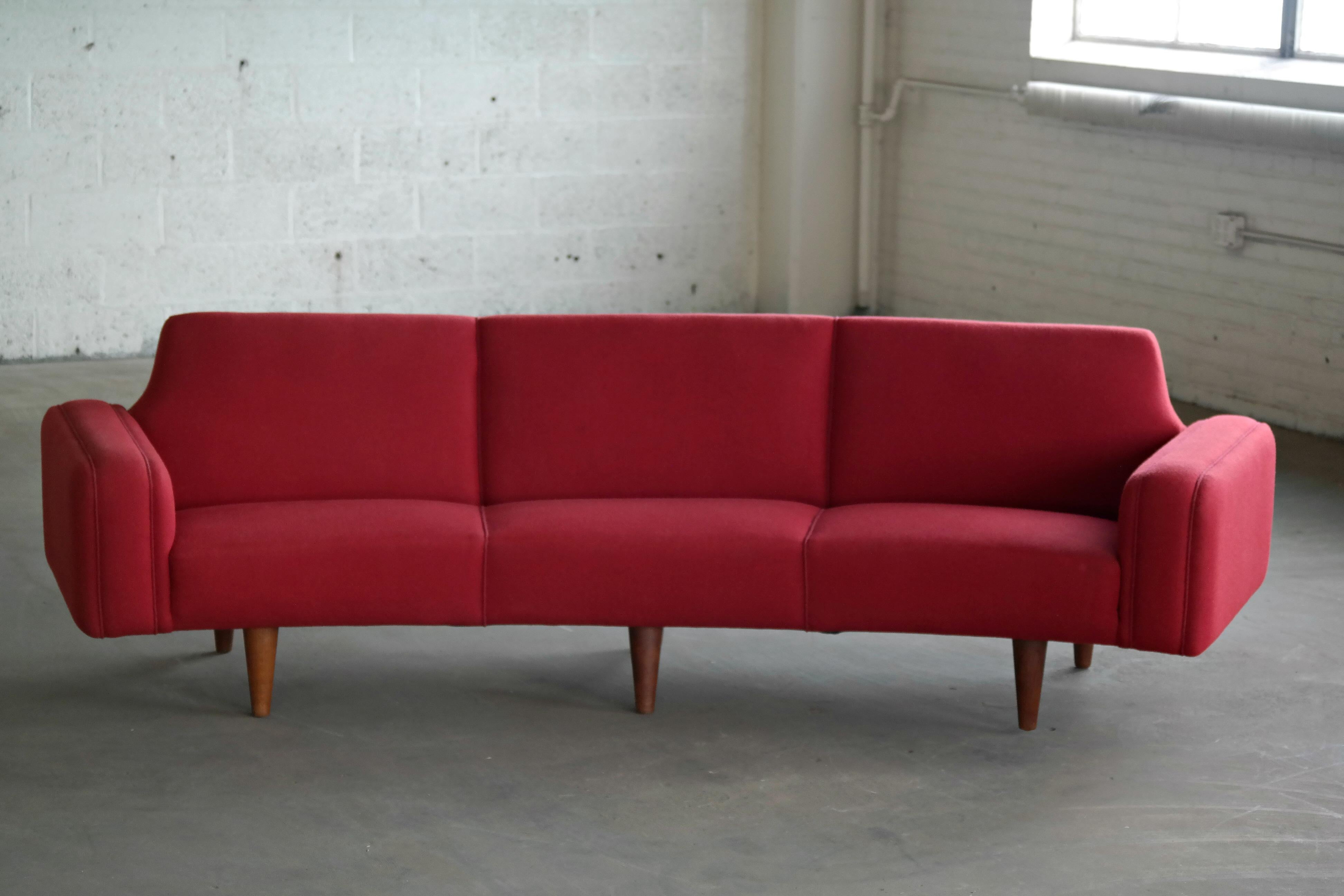 Illum Wikkelso is know for his fantastic sofa and chair designs and this rare model 450 sofa designed in 1958 and manufactured by Aarhus Polstrings Møbelfabrik in the 1960s is absolutely one of the finest to come out of the Danish midcentury era. In