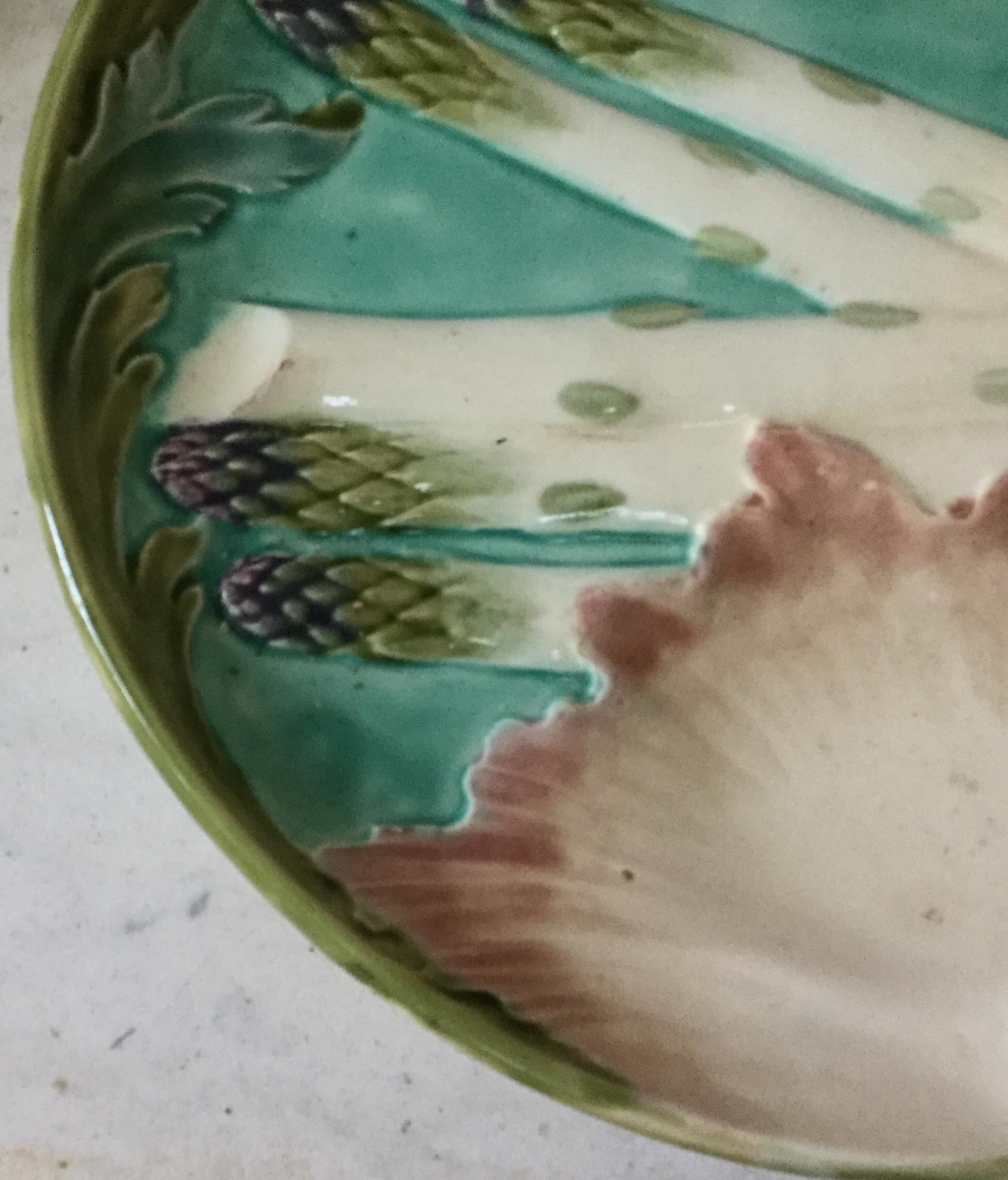 Large Majolica asparagus plate signed Keller et Guerin Luneville, circa 1880.
This plate exist in different colors and sizes this one is the largest size.
A set of smaller size is also available.