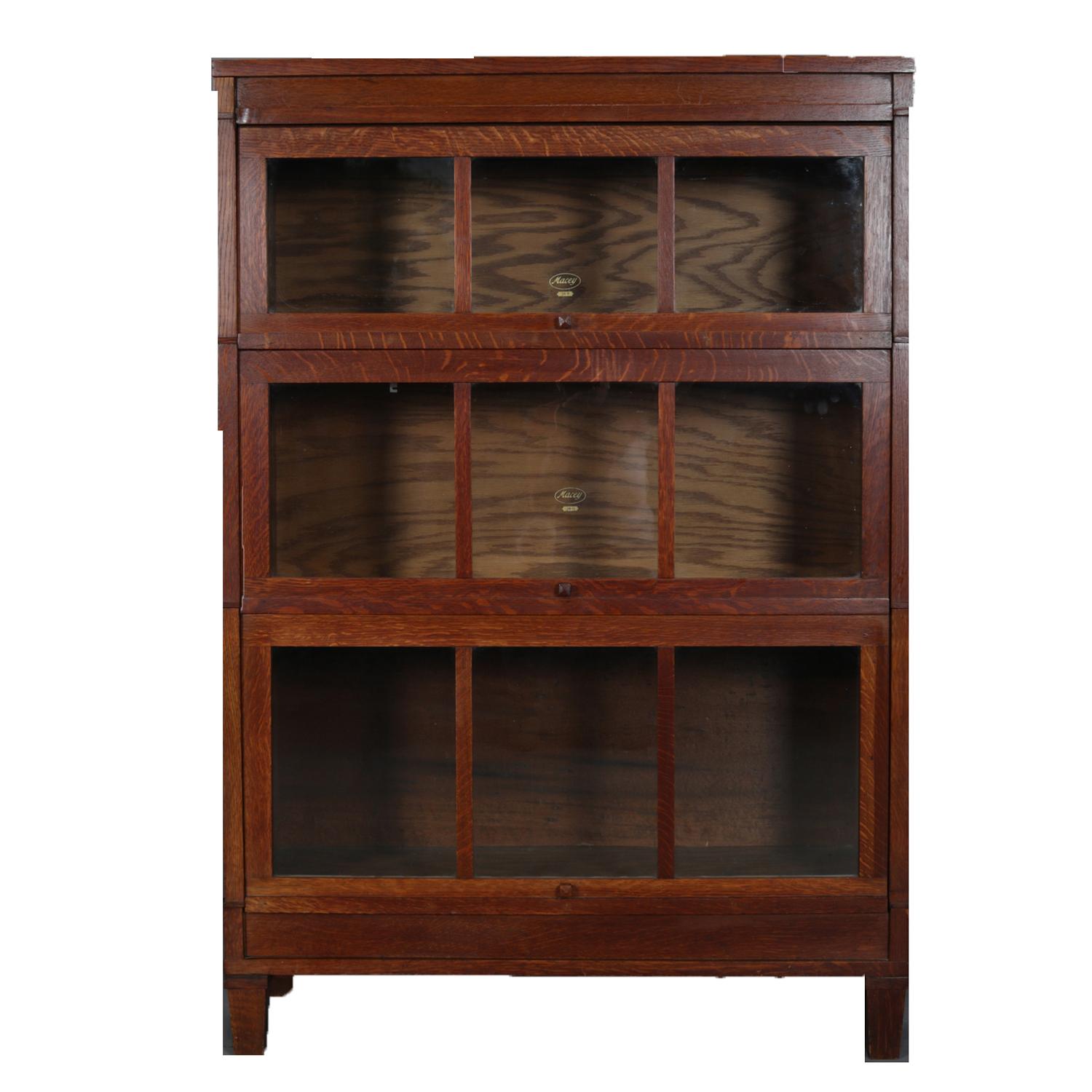 Arts & Crafts mission oak Barrister bookcase by Macey features three stacks each with traditionally recessing 