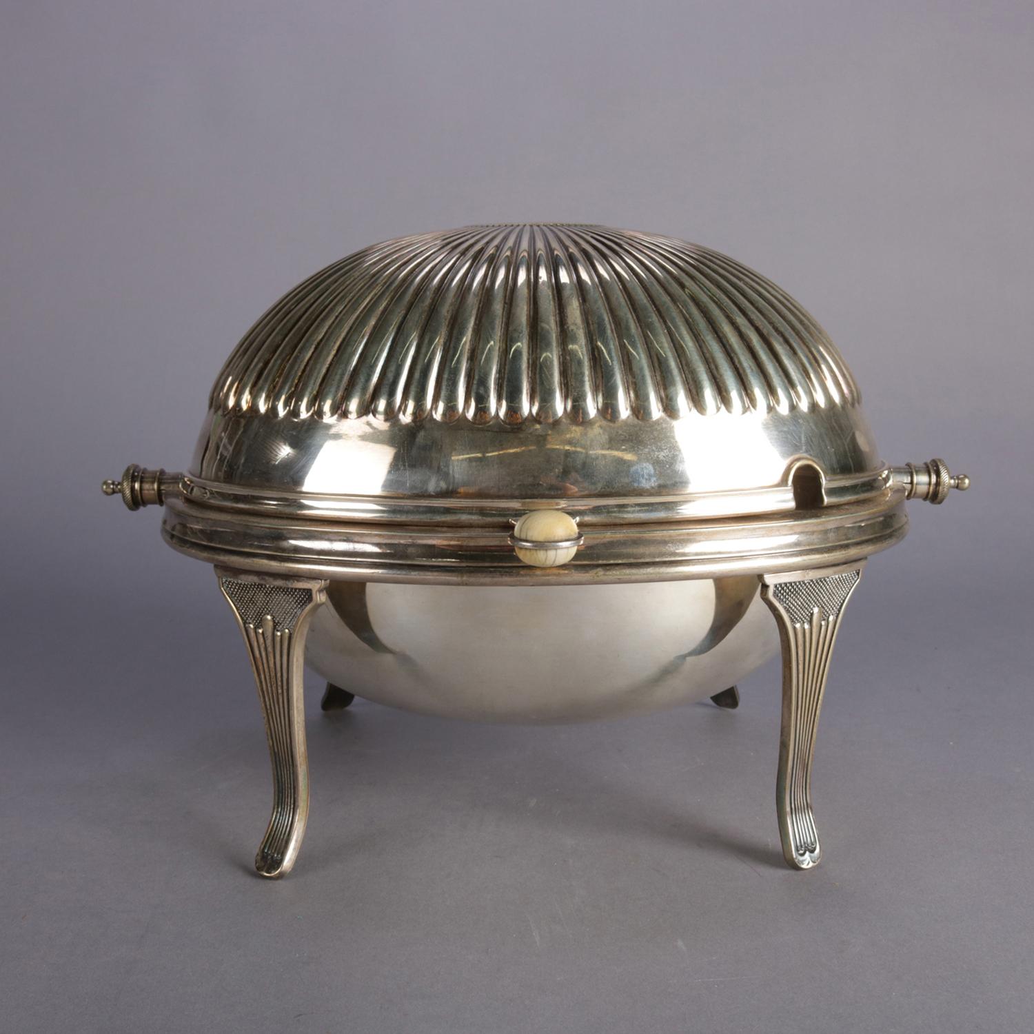 English Georgian formal silver plate serving dish features revolving melon form top with bone handle and is raised on tapered legs, marked on base as photographed, circa 1920.

***DELIVERY NOTICE – Due to COVID-19 we are employing NO-CONTACT