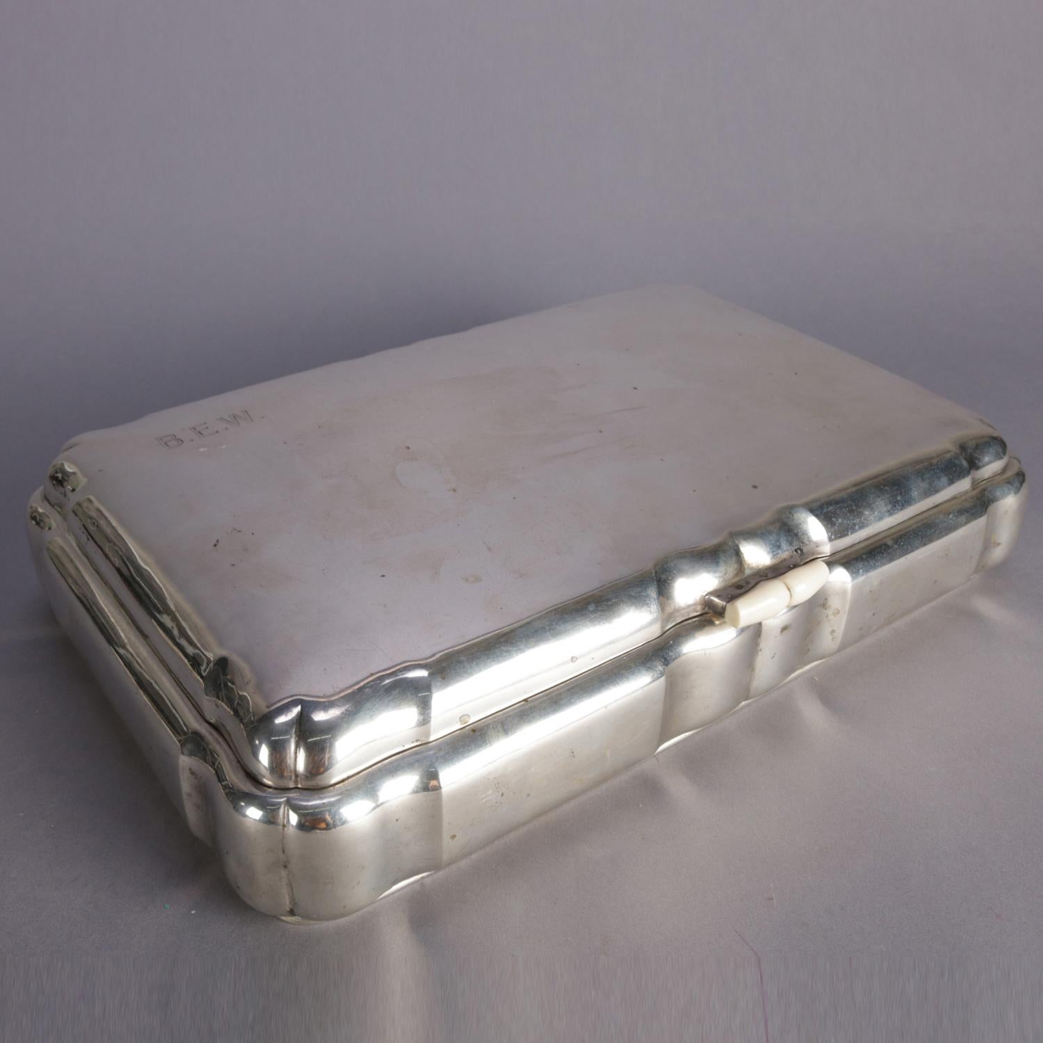 Czechoslovakian oversized cigar box features .800 silver construction with gold wash and mahogany interior, en verso hallmarks include .800 fineness silver, triangle with cross, three hills and FB maker Frantisek (Franz) Bibus, on lid B.E.W.