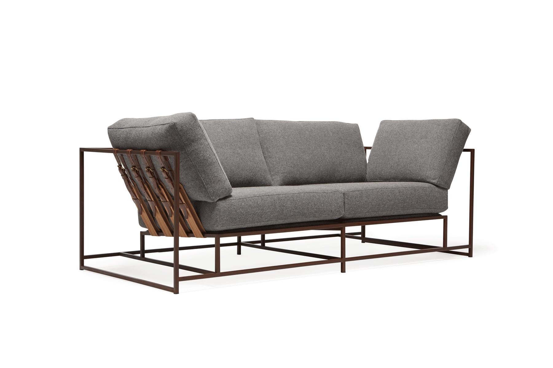 The Inheritance Two Seat Sofa by Stephen Kenn is as comfortable as it is unique. The design features an exposed construction composed of three elements - a steel frame, plush upholstery, and supportive belts. The deep seating area is perfect for a