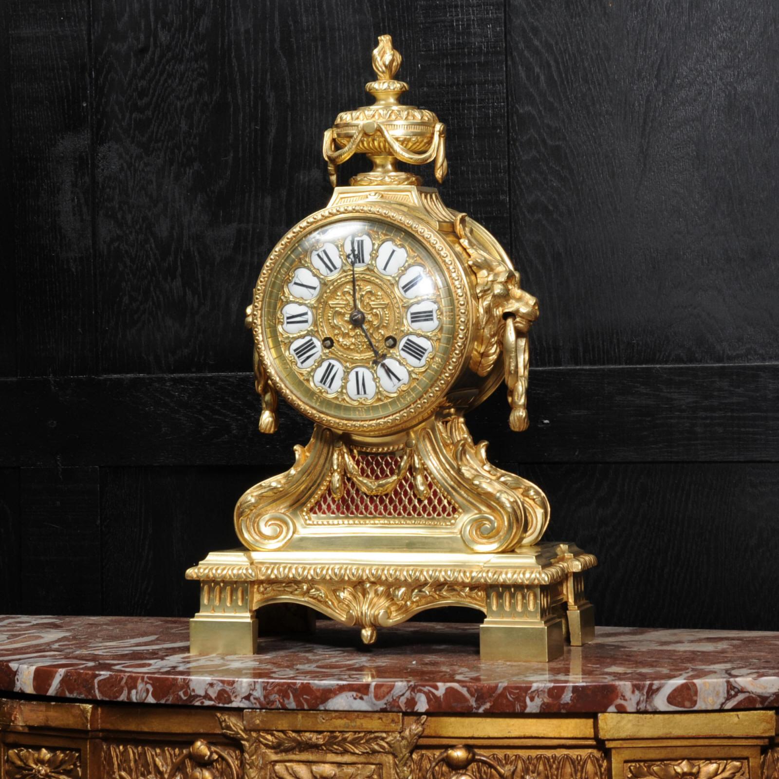 A large, imposing and heavy original antique French gilt bronze clock. It is a beautifully made drum head clock in the classical style of Louis XVI and retailed by G. Philippe, of the prestigious Gallery Montpensier of the Palais Royal. The movement