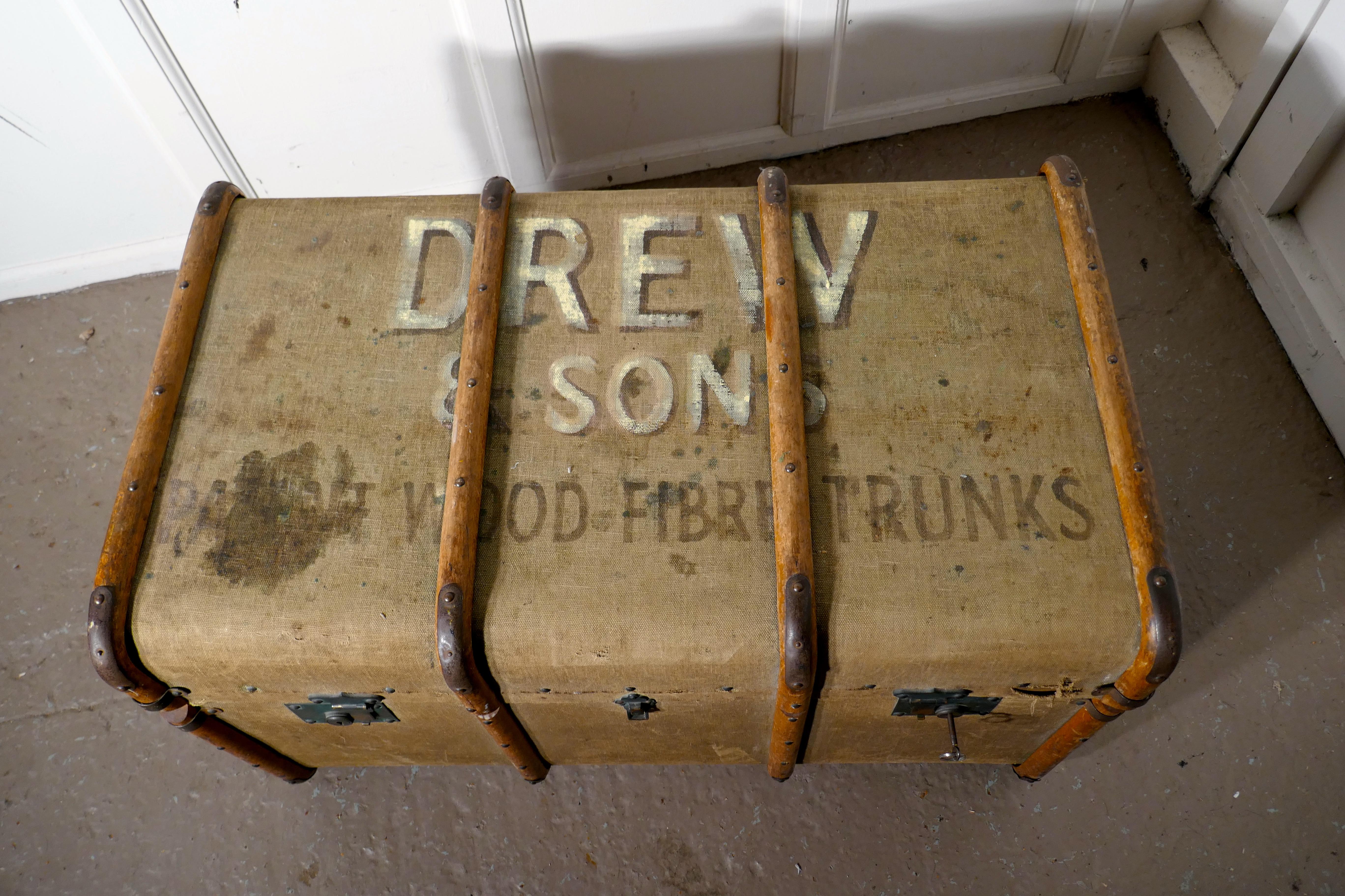 A large vintage Drew & Sons canvas steamer trunk

A very useful decorative suitcase or travel trunk, it is lined in a lightly striped fabric with a removable tray to the interior
The trunk is brass and wood bound, the locks are working and we