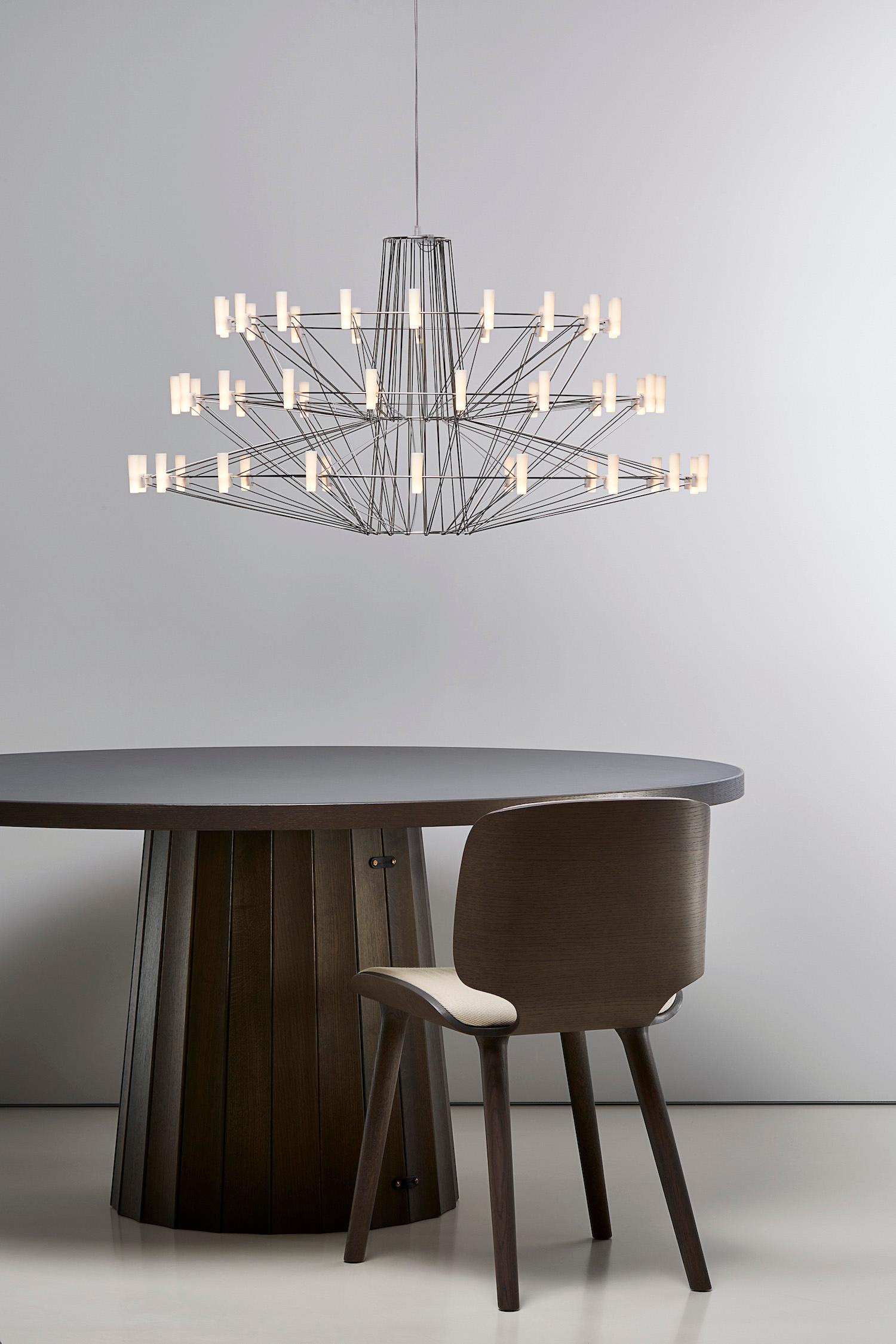 Coppélia is a suspension chandelier that comes as either a 54 or 36 LED tube version. The sizes are either 39.8