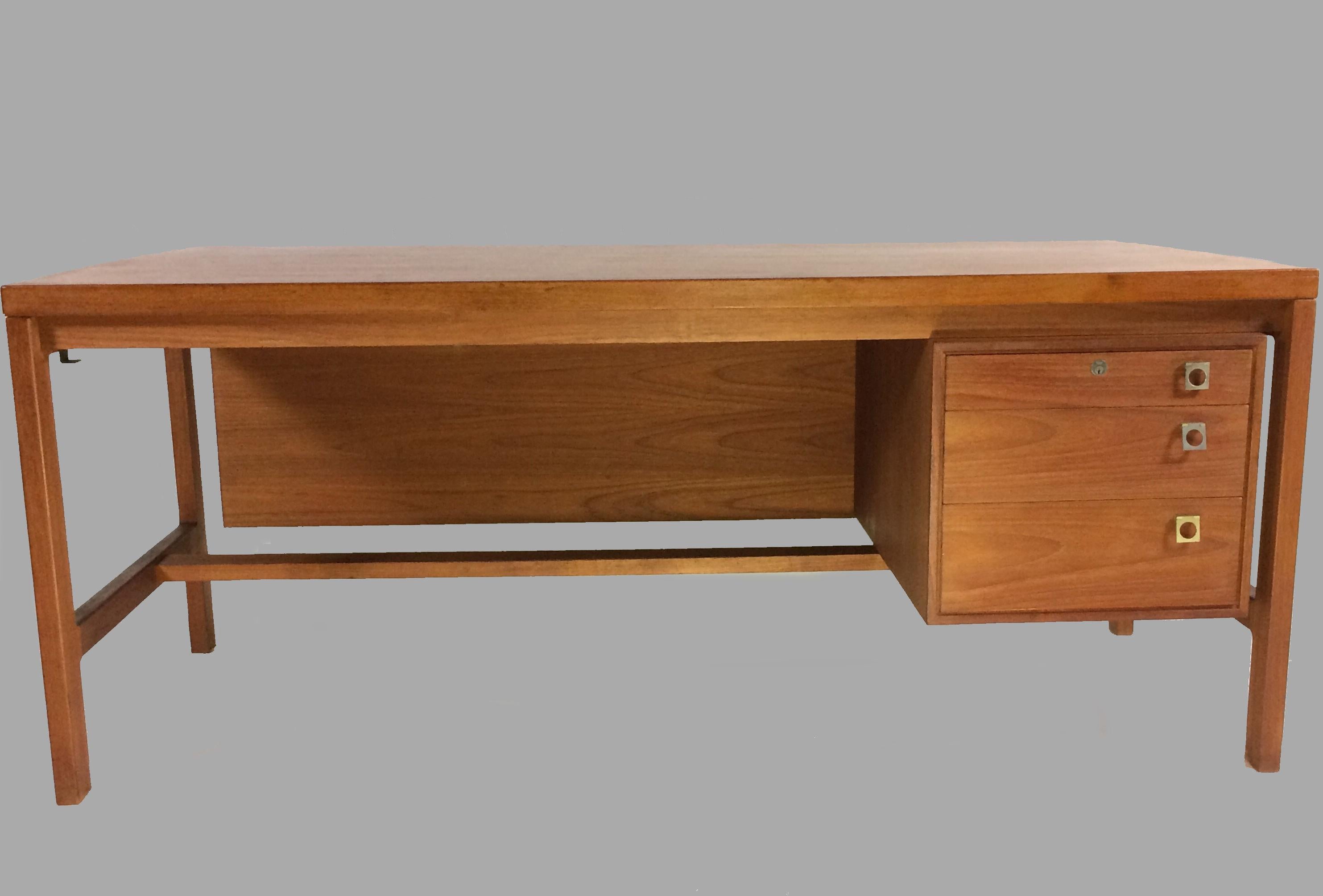 Large executive desk in teak designed by Arne Vodder for Sibast Møbler.

The spacious desk is well designed and not least well crafted not only by hand by also by heart to create not only a strong structure but also to bring out the grain of the