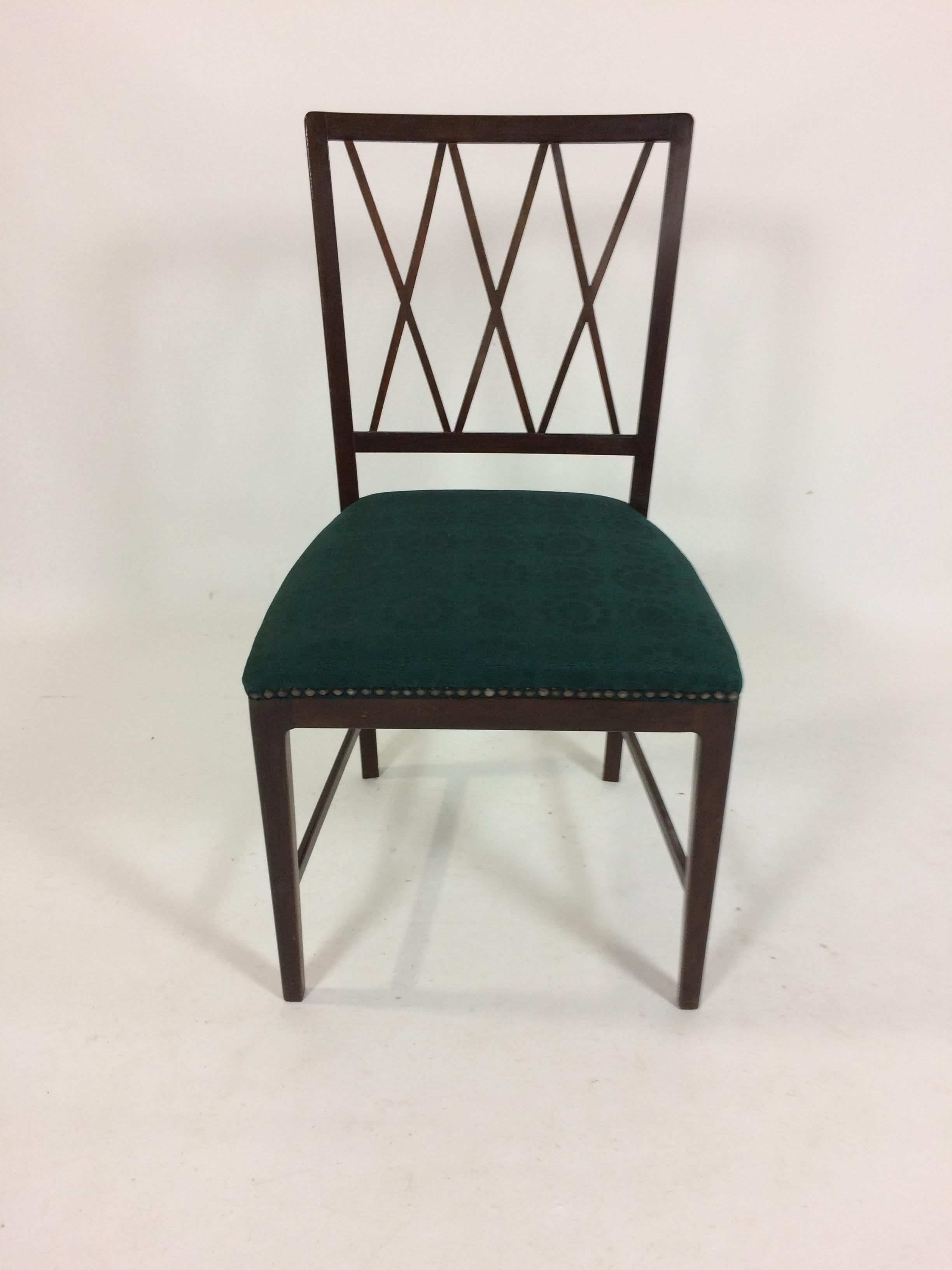 Set of six dining chairs in tanned oak designed by Ole Wanscher in 1953 for A.J. Iversen.

The chairs have been overlooked and refinished by our cabinetmaker to insure that they are in very good condition with only minimal signs of age and use and
