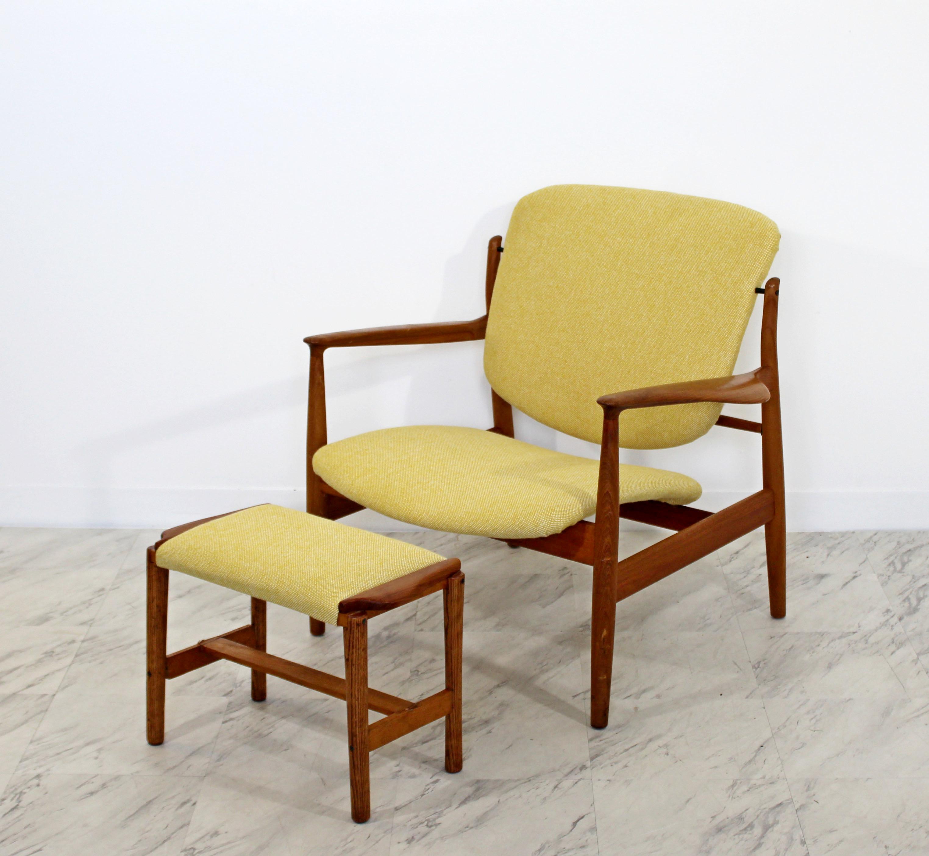 For your consideration are a magnificent, Danish teak armchair and ottoman, newly reupholstered in vintage fabric, by Finn Juhl for John Stuart, circa the 1950s. In very good condition. The dimensions of the chair are 32