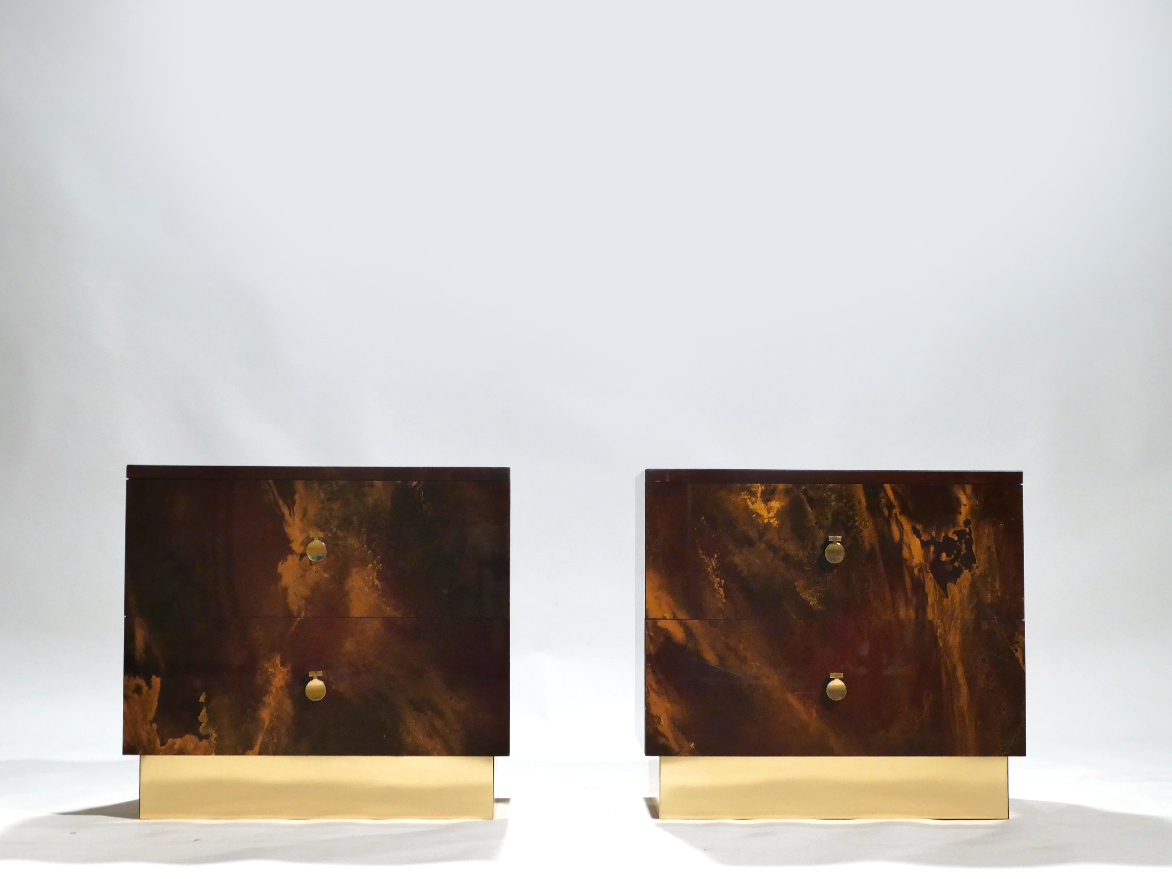 This pair of end tables are exciting examples of French design firm Maison Jansen’s commissioned pieces. They’re made from solid mahogany, lacquered in a rich dark brown and bronze–golden finish; the resulting effect is a beautiful mottling of color