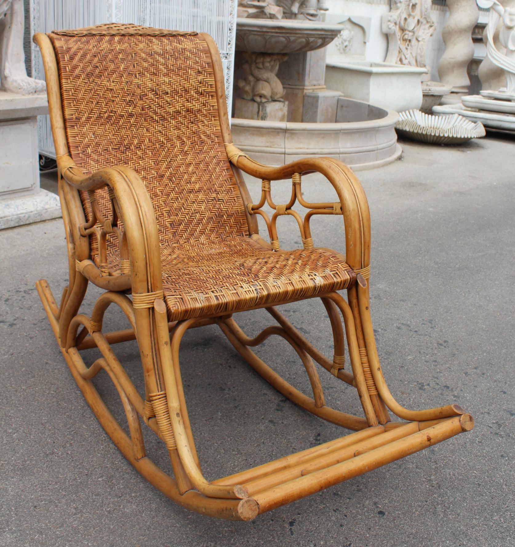 1980s Spanish bamboo and laced wicker rocking chair.