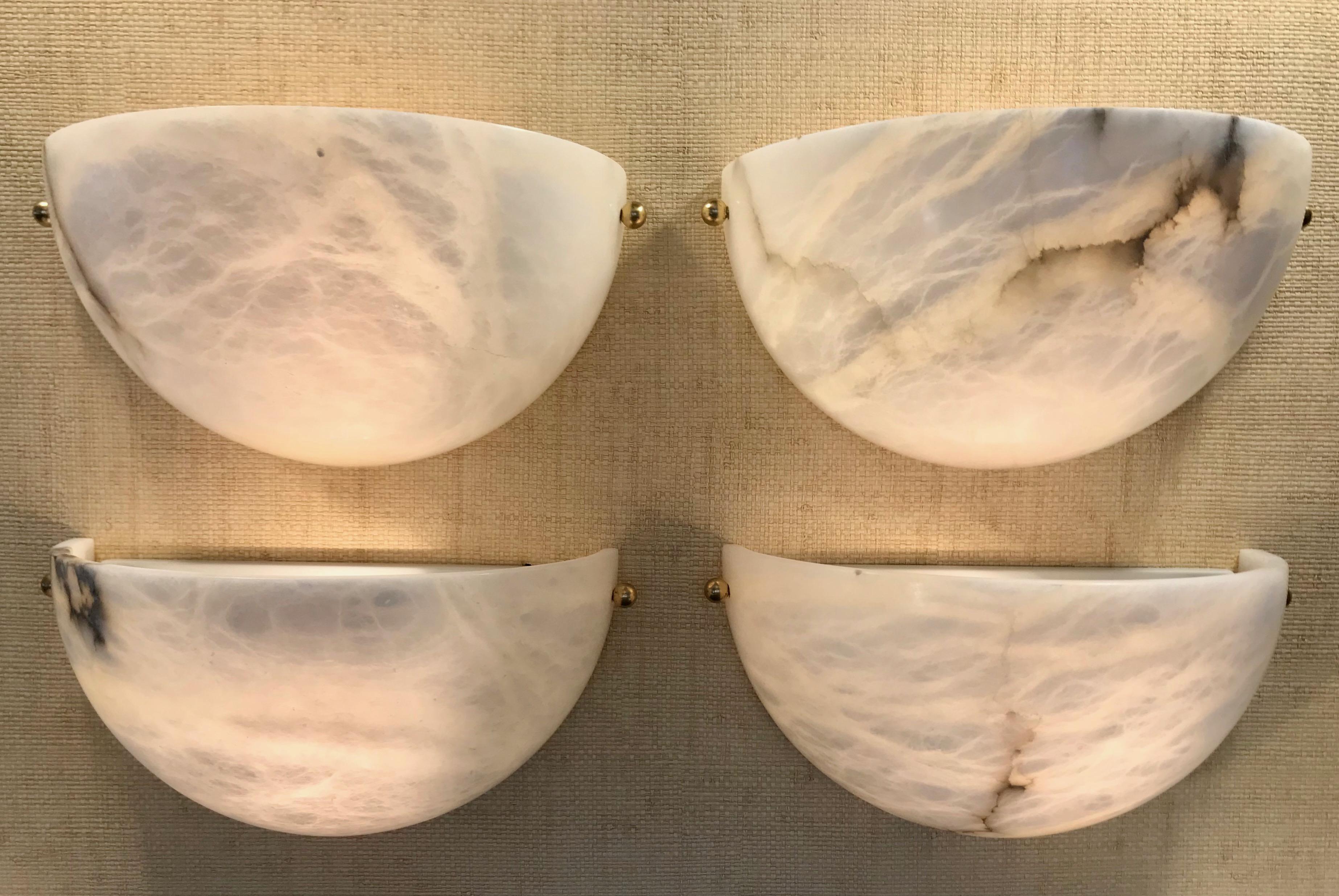 Two pairs of alabaster wall sconces in quarter sphere form by Lightolier. Original natural alabaster shades imported and manufactured in Spain for Lightolier. Rewired for US installation, each sconce uses a single A or Edison base bulb. Priced and